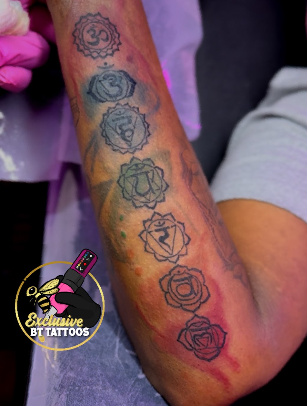 Chakra symbols and roses ornamental tattoo on the forearm by @x1u5iv3bttattz