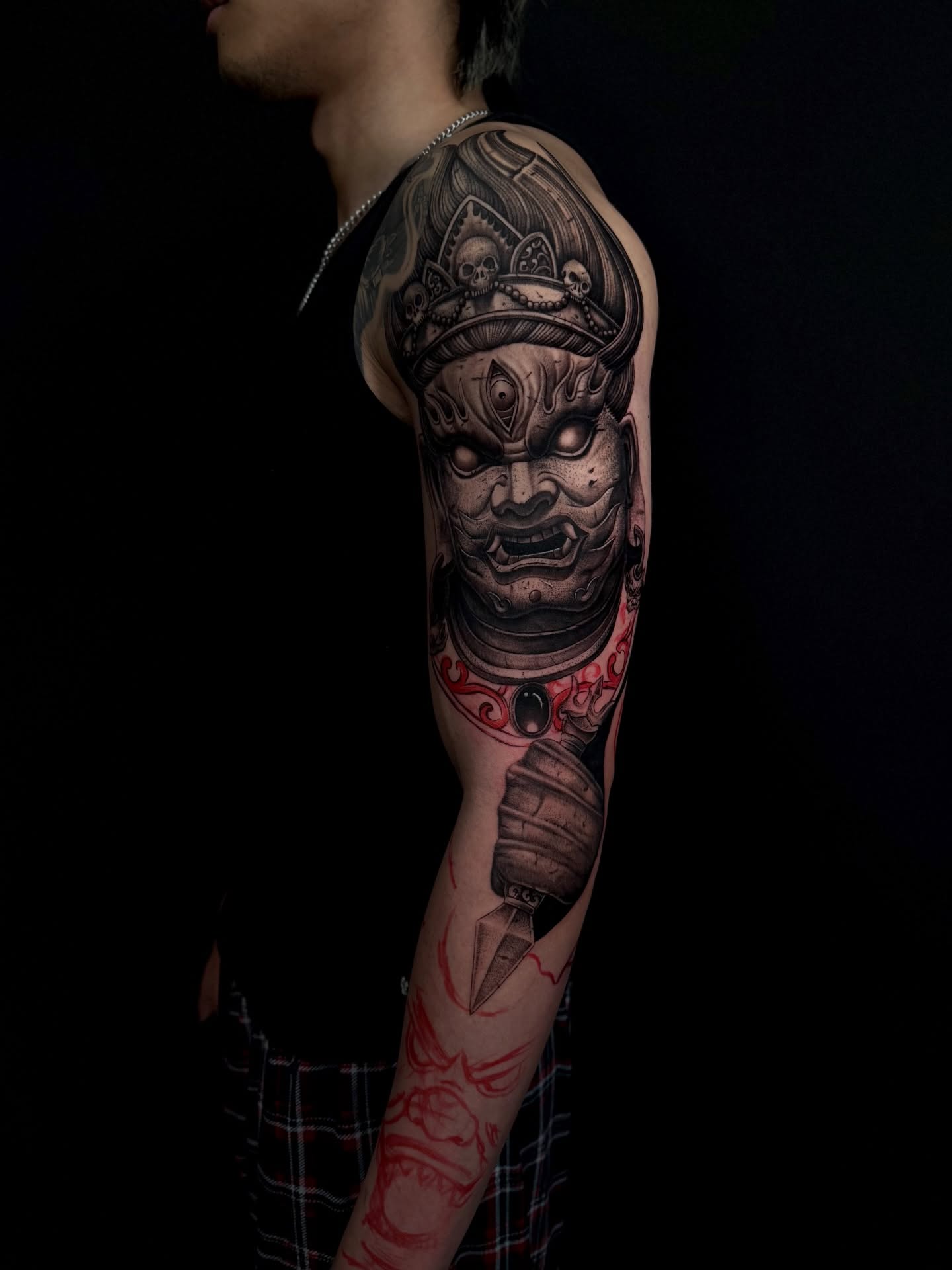 Warrior mask dark realism tattoo on the forearm by Anh Nguyen