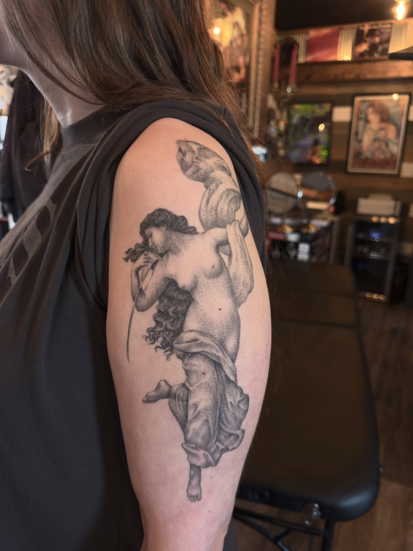 Nude female figure dotwork tattoo on the upper arm by Kevin Rotramel, Dayton, Ohio
