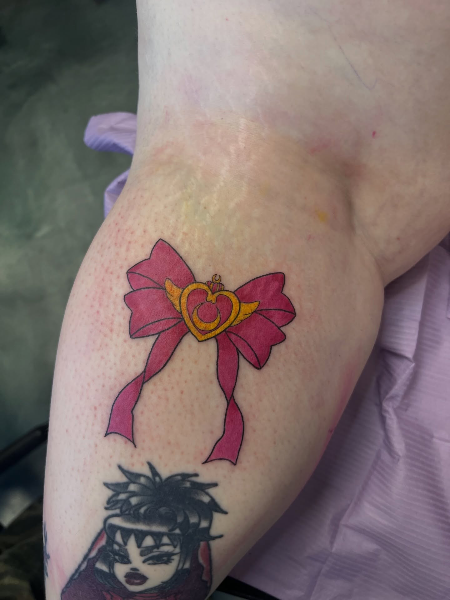 Sailor moon ribbon anime tattoo on the forearm by Leslie Paskoff
