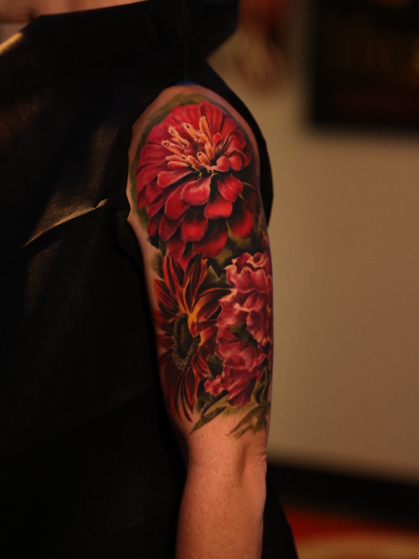 Floral bouquet realism tattoo on the forearm by Brandon Sontag