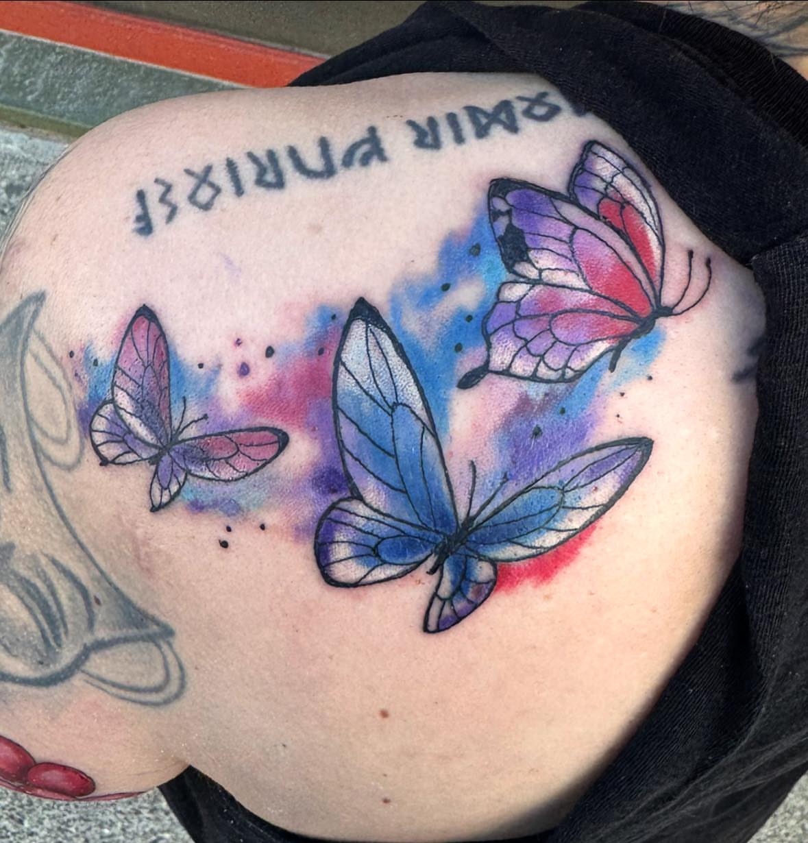 Butterflies watercolor tattoo on the back by Misty Dawn Brothers, Dayton, Ohio