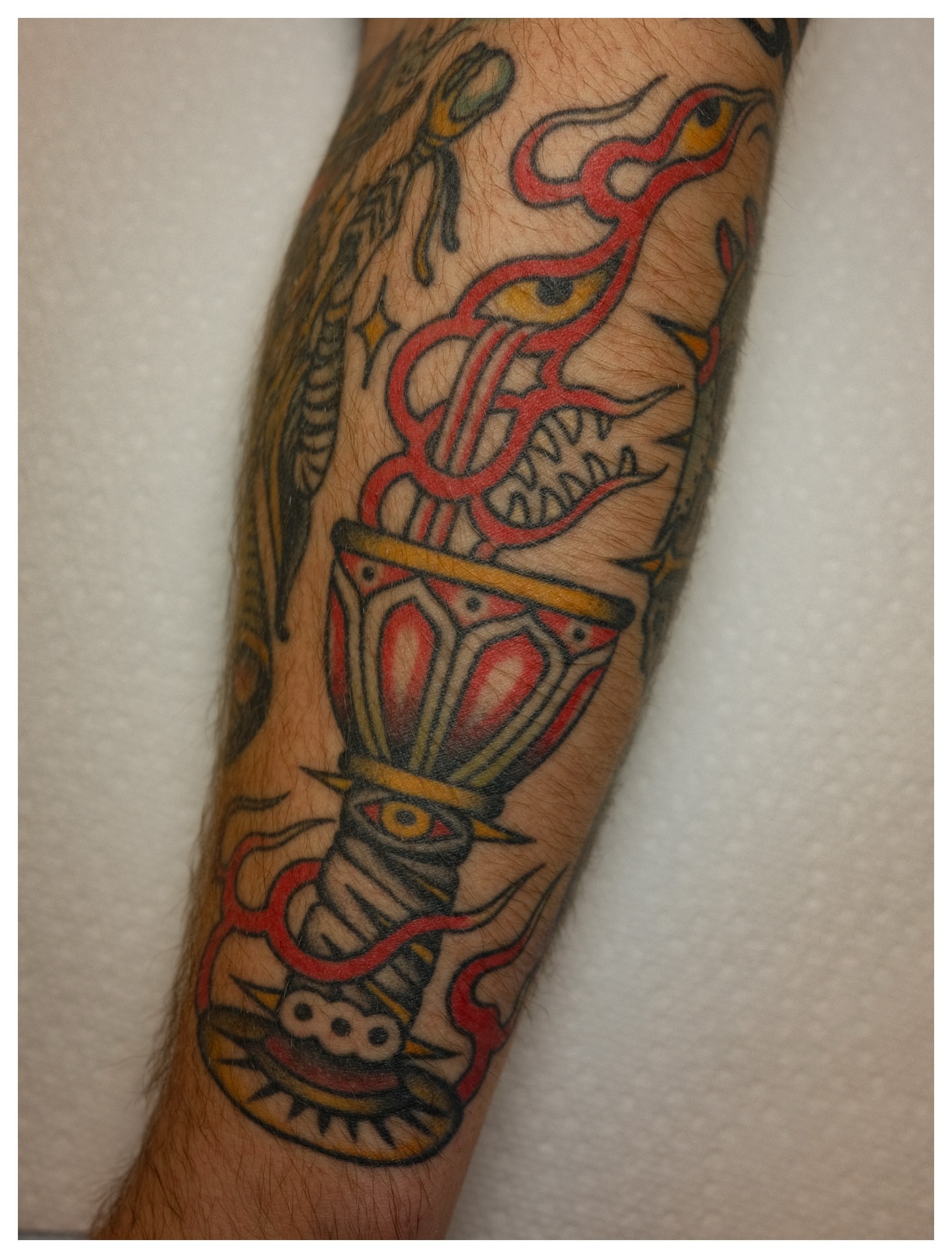 Musical instrument American traditional tattoo on the forearm by Tony Talbert, Fredericksburg, Virginia