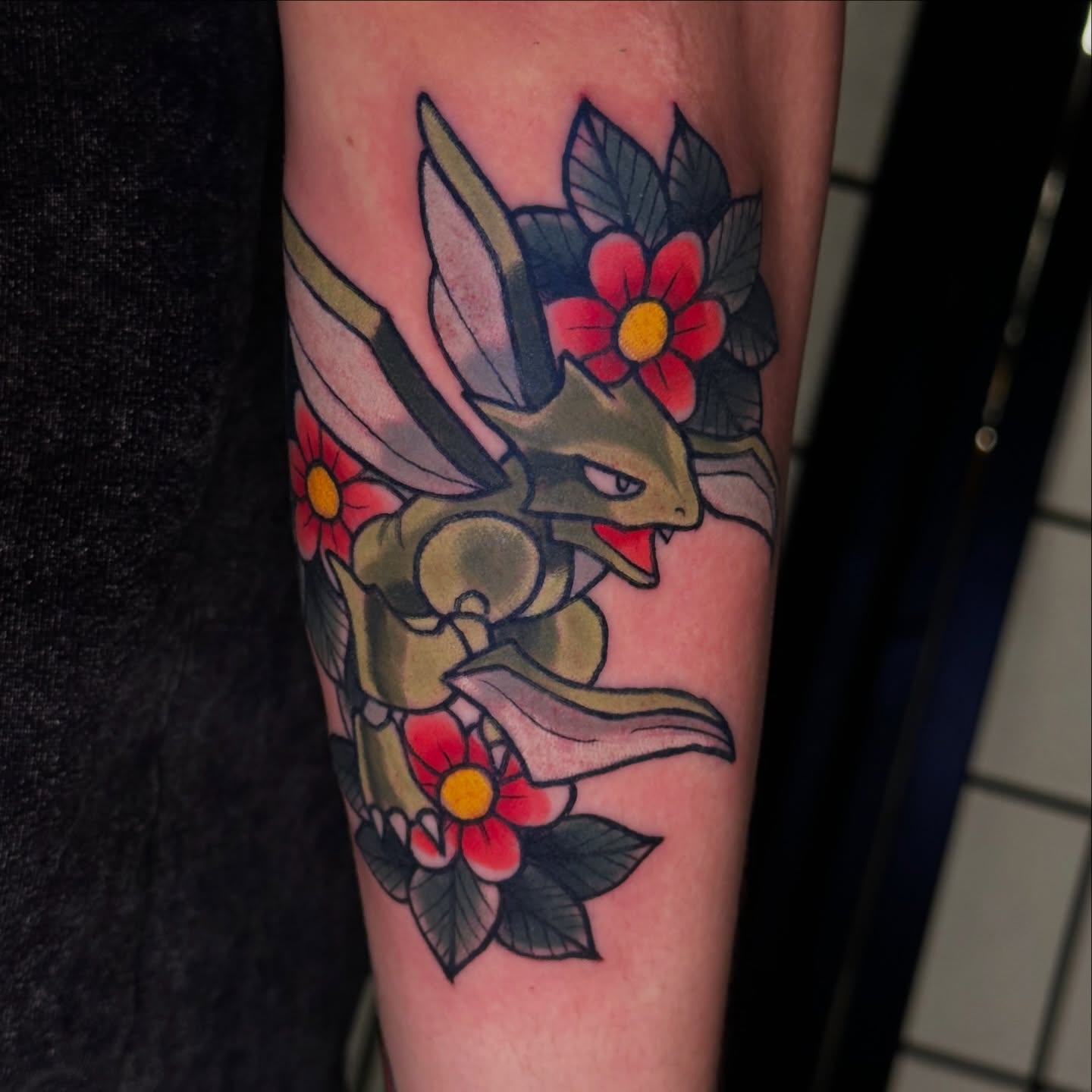 Psyduck with flowers new school tattoo on the forearm by Robert Douglas