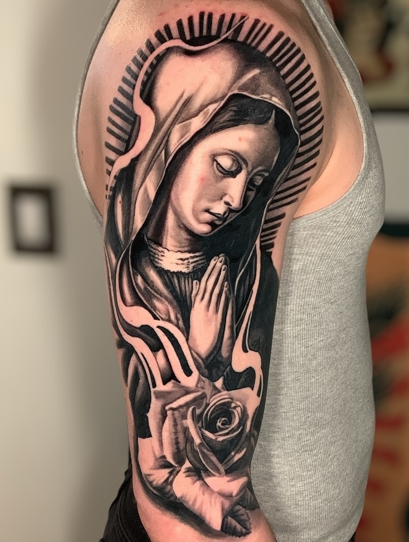 Praying woman realism tattoo on the forearm by james padelt
