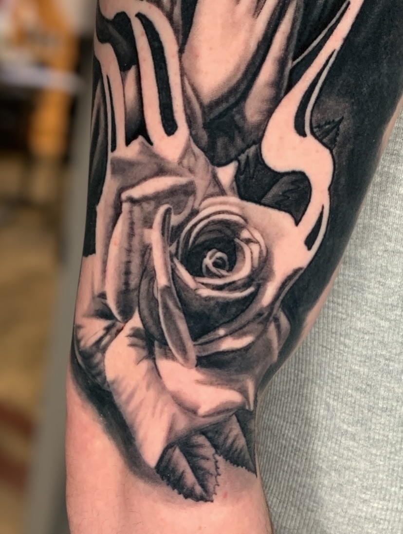 Rose realism tattoo on the forearm by james padelt