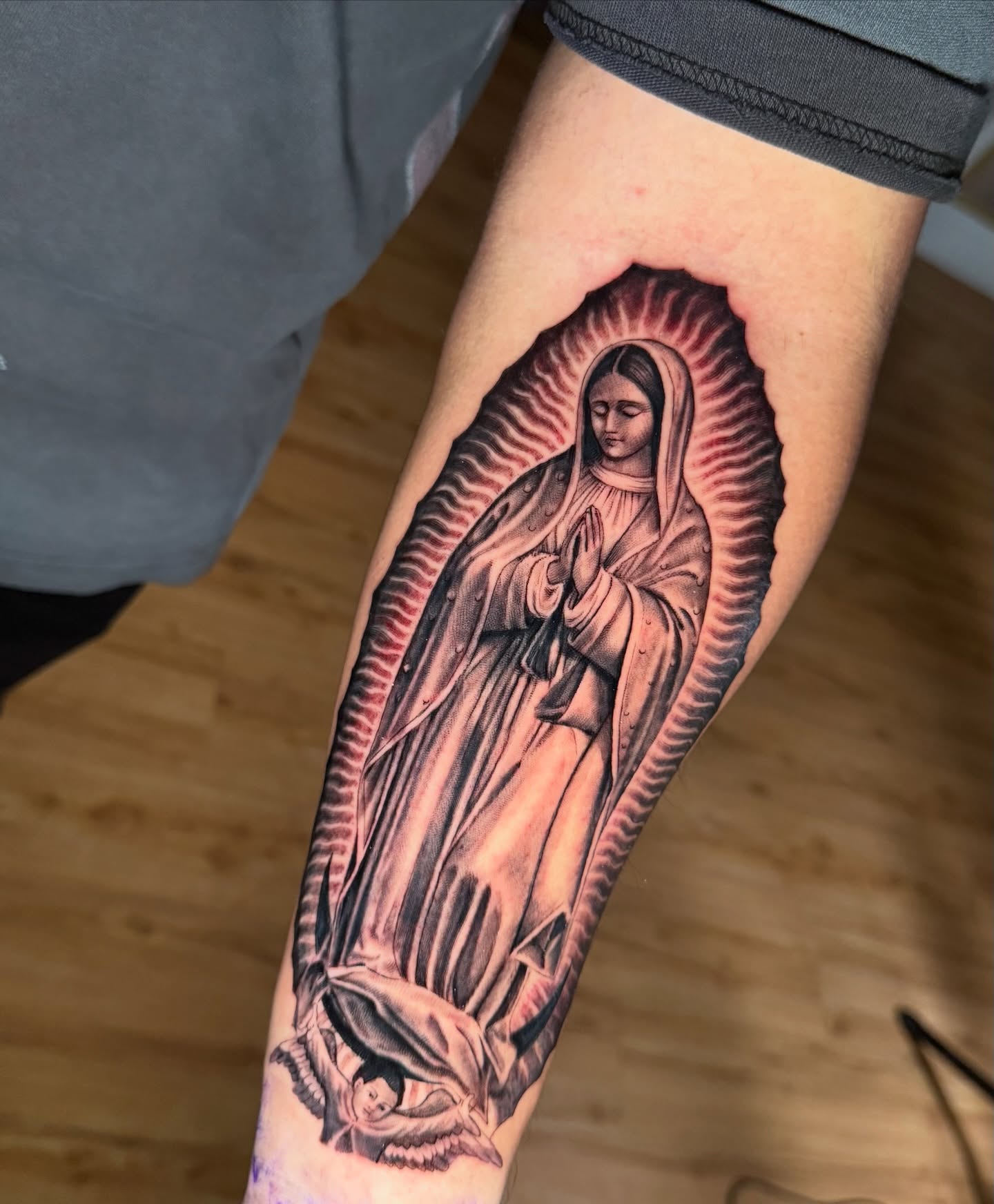 Our Lady of Guadalupe realism tattoo on the forearm by Gilberto Flores Nava