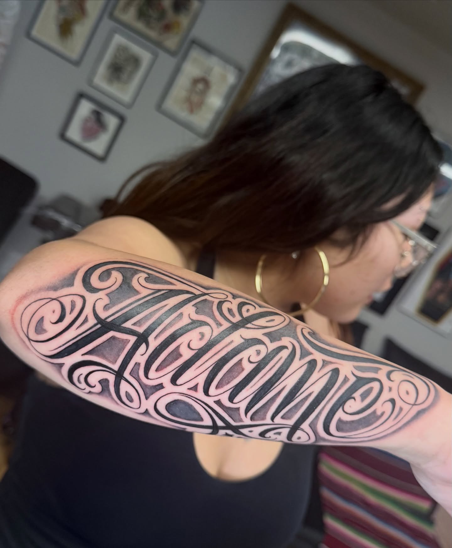 Script lettering lettering script tattoo on the upper arm by Gilberto Flores Nava