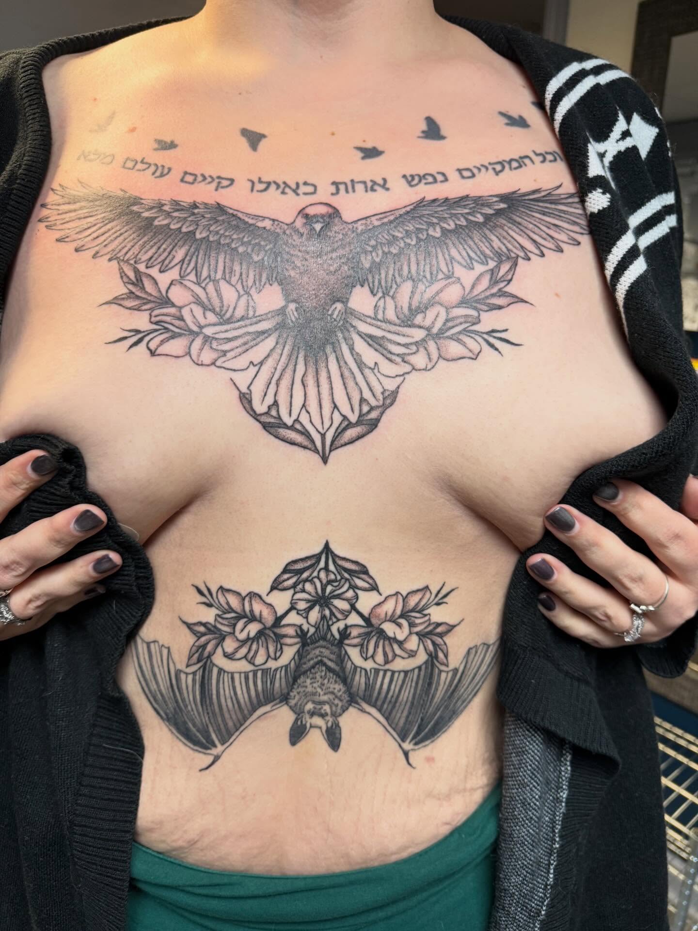 Eagle and flowers black and grey tattoo on the chest by Elena