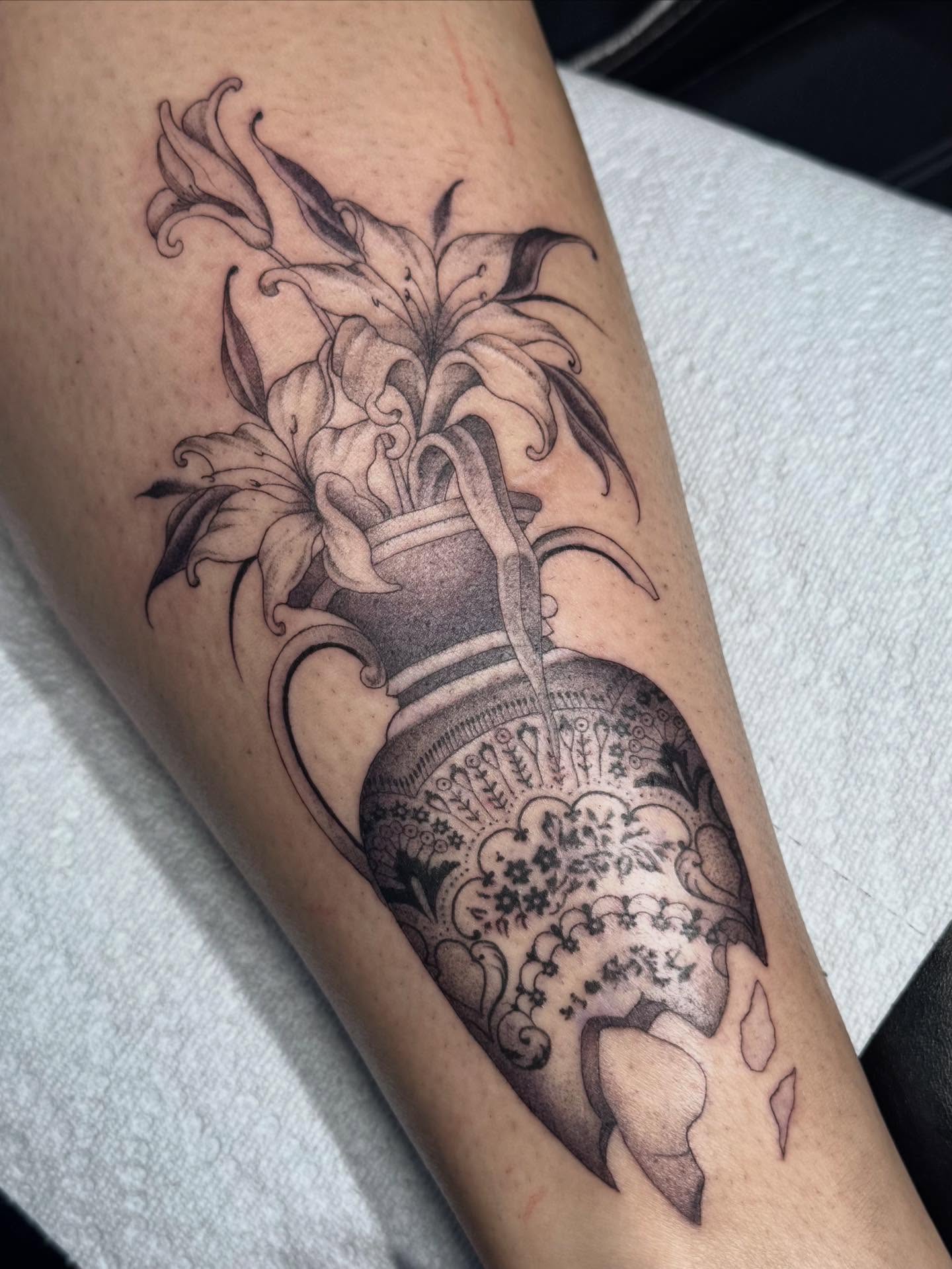 Lily vase black and grey tattoo on the forearm by Nat🫧