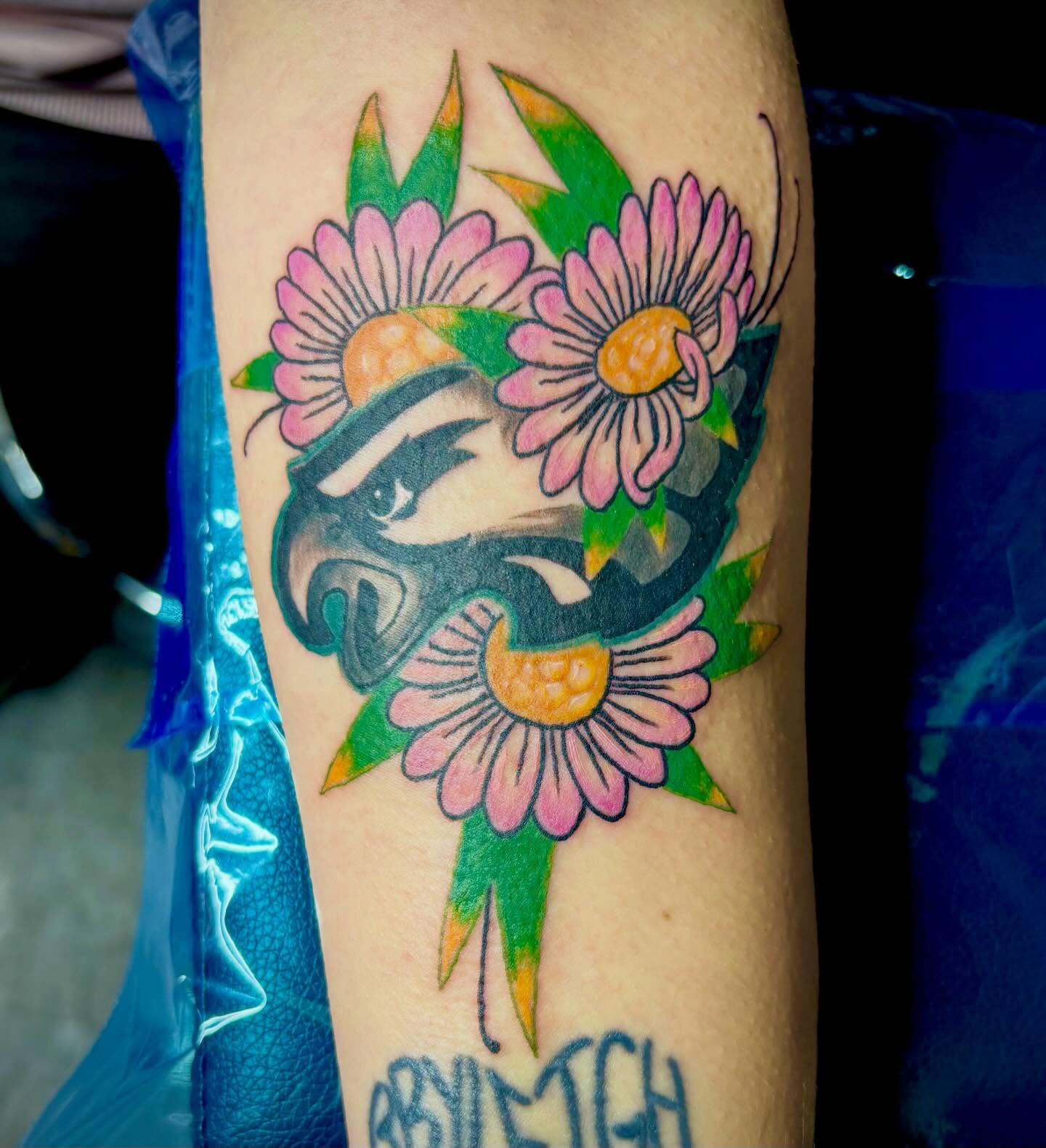 Badger with flowers American traditional tattoo on the forearm by Rayne