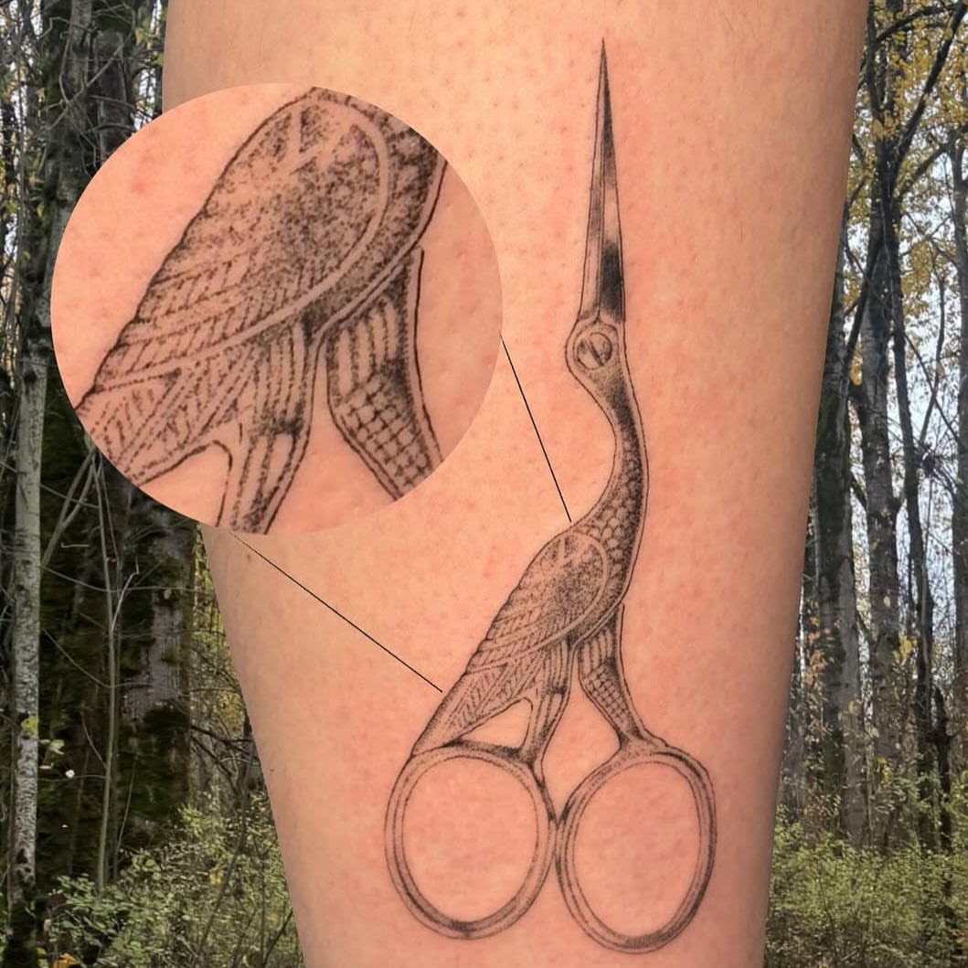 Scissors black and grey tattoo on the leg by Ivy