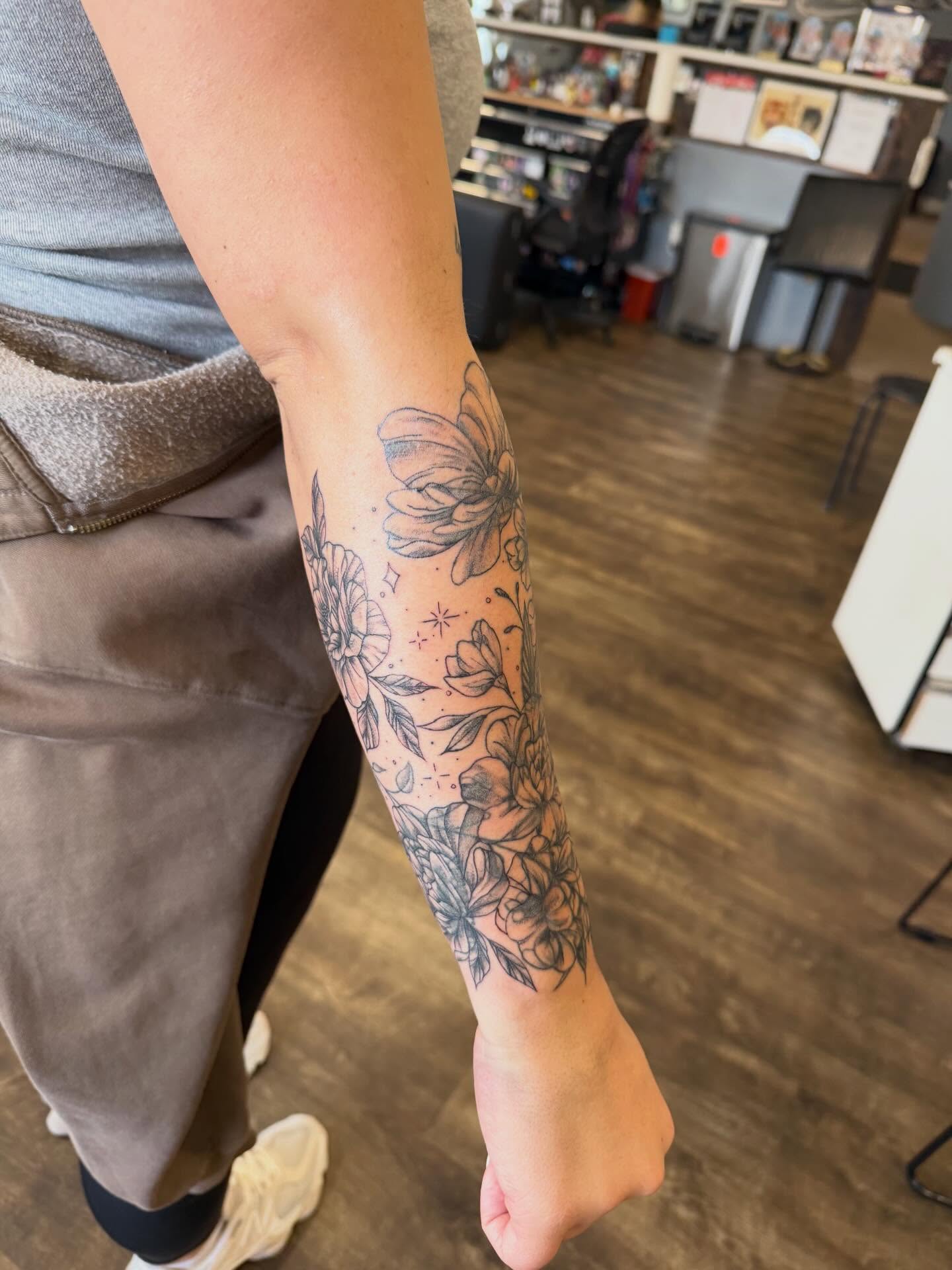 Floral bouquet black and grey tattoo on the forearm by Hope Powell, Vancouver, Washington