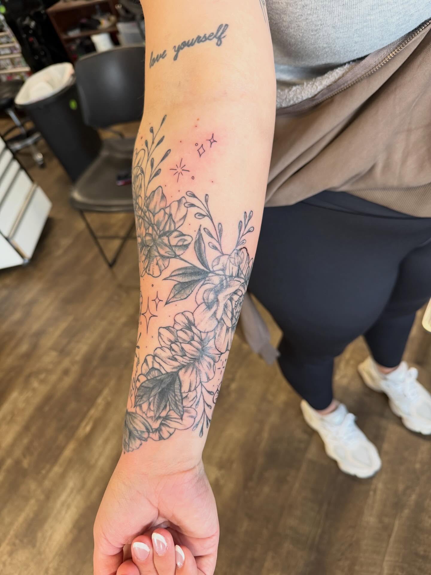 Floral bouquet black and grey tattoo on the forearm by Hope Powell, Vancouver, Washington