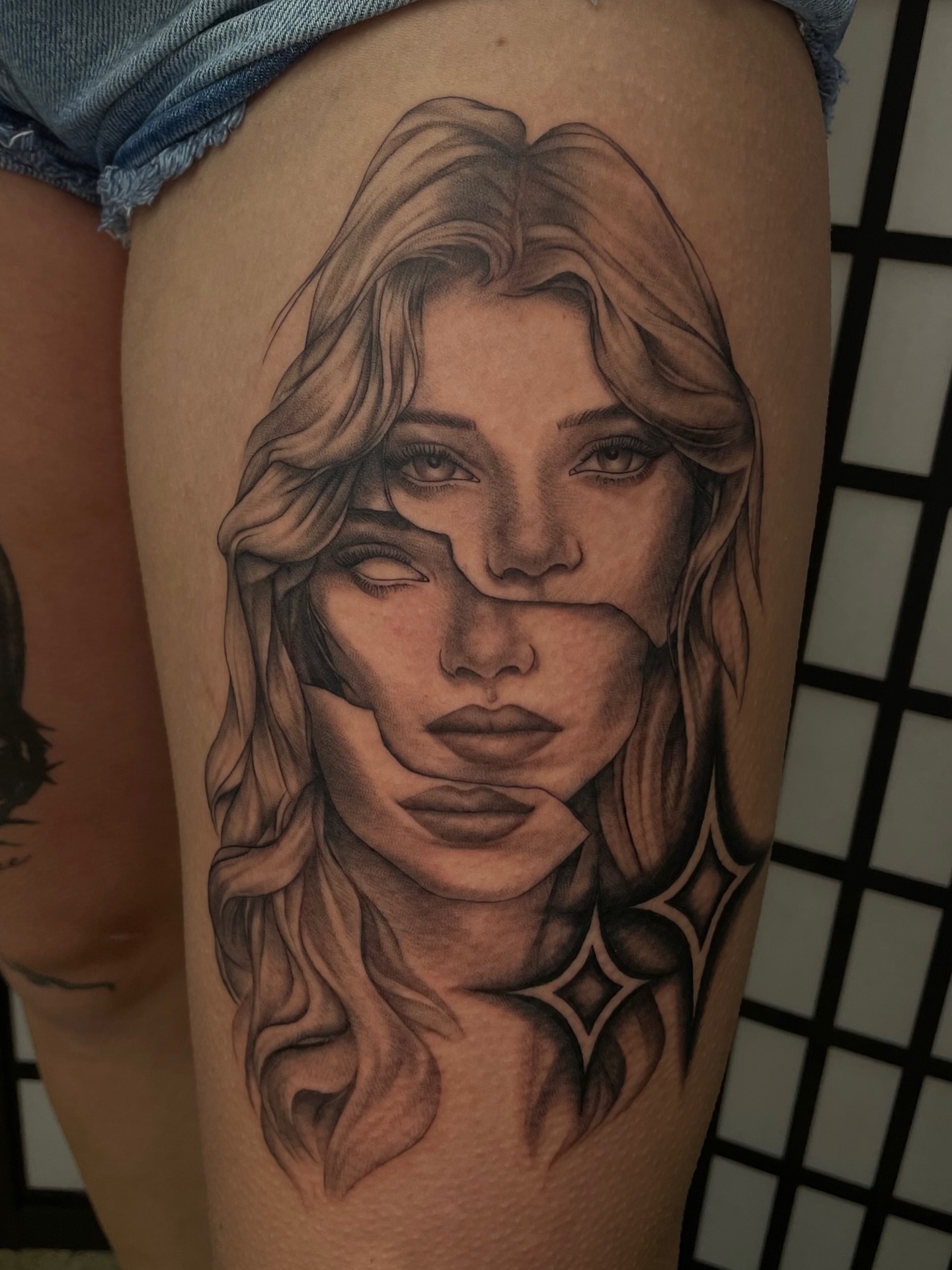 Portrait realism tattoo on the thigh by kaylee