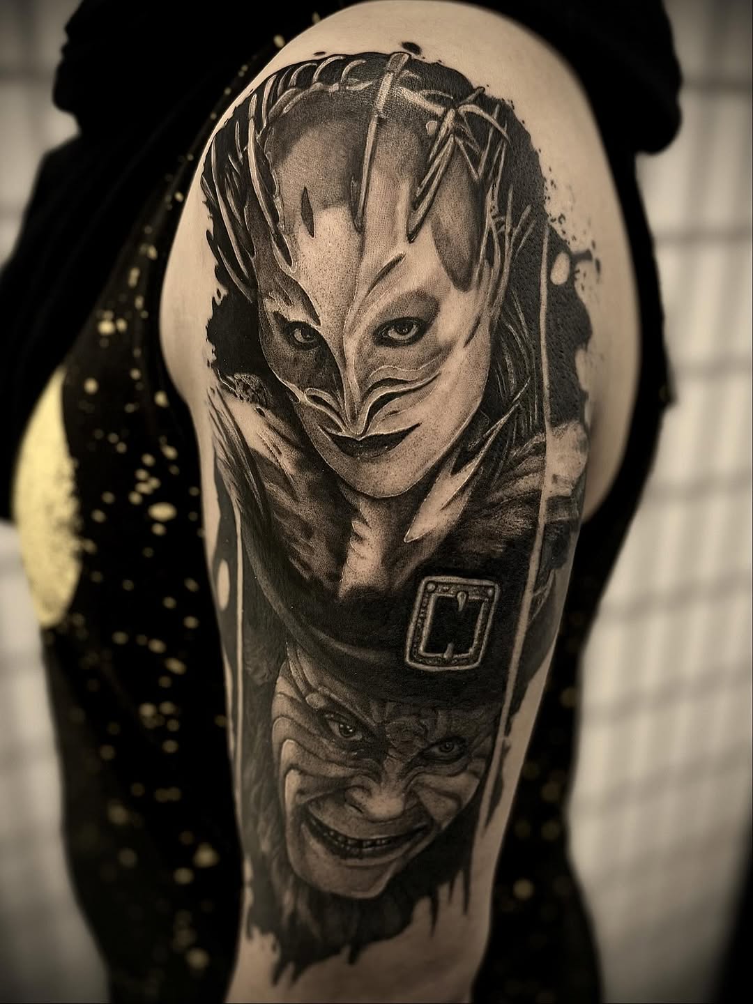 Two horror characters realism tattoo on the upper arm by Mandi Marie, Charlotte, North Carolina