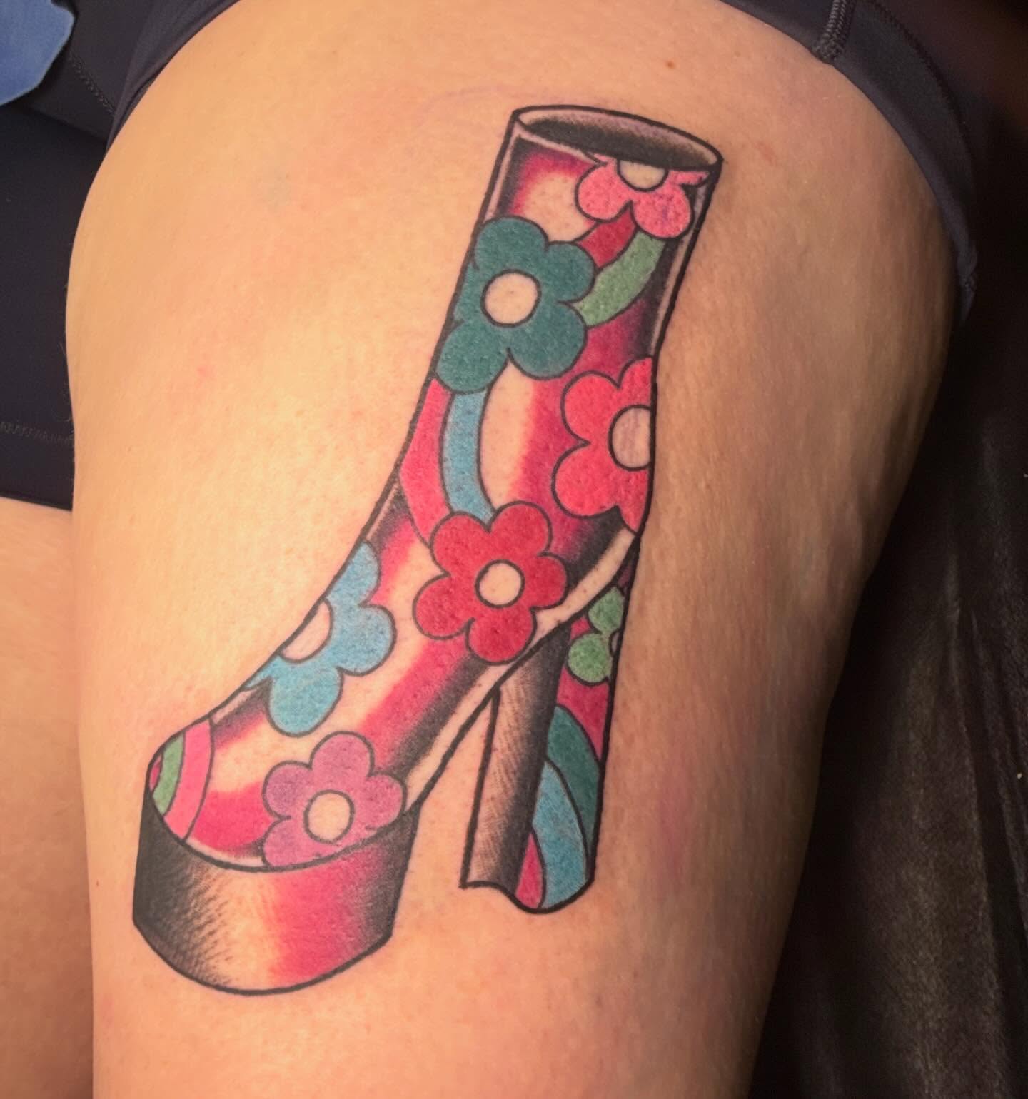 High heel shoe American traditional tattoo on the thigh by Erin McDavis
