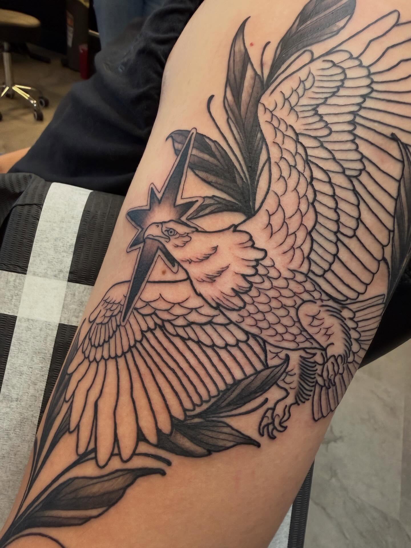 Eagle with star black and grey tattoo on the forearm by Kyle Behr