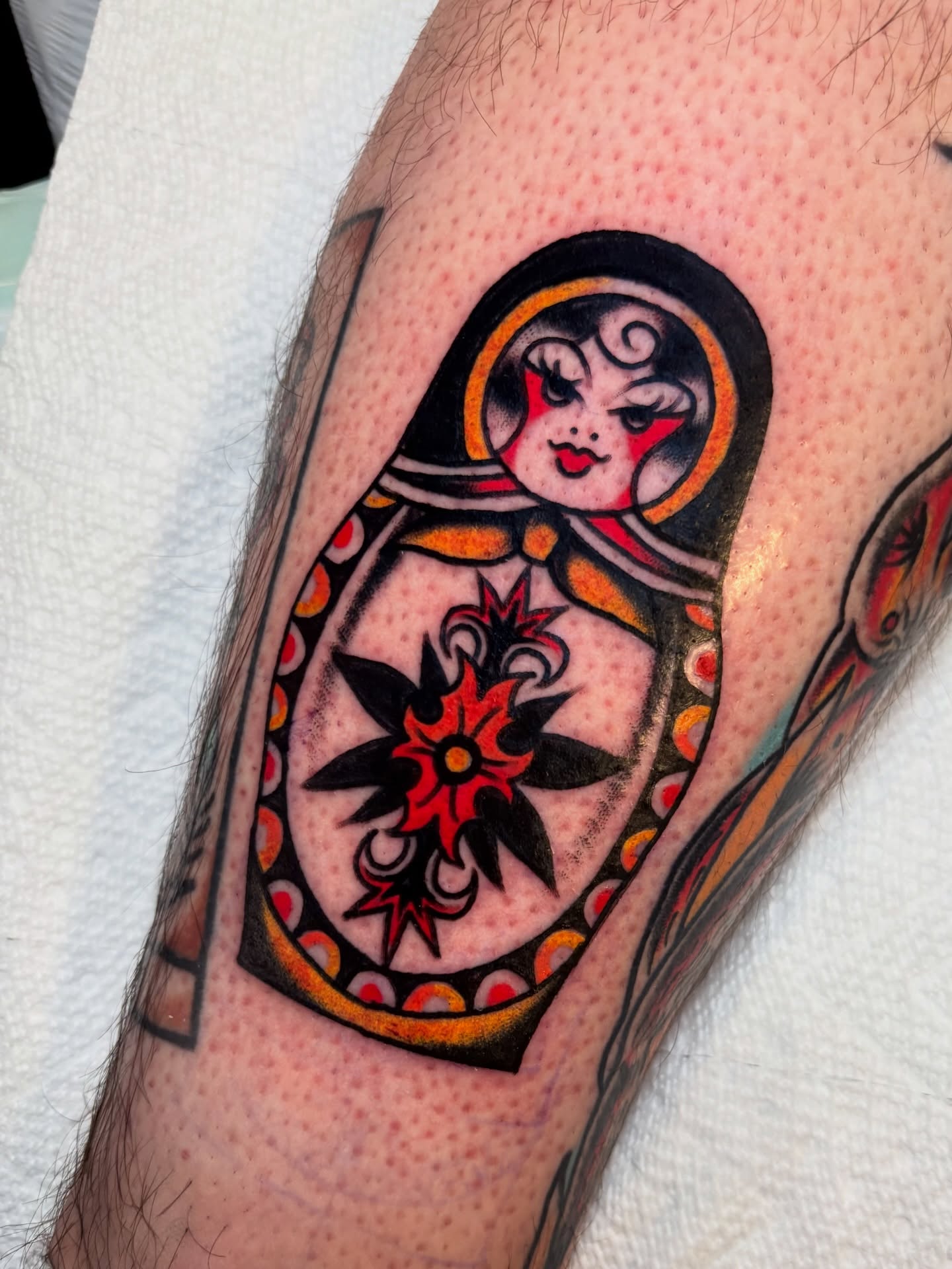Matryoshka doll American traditional tattoo on the forearm by Nick