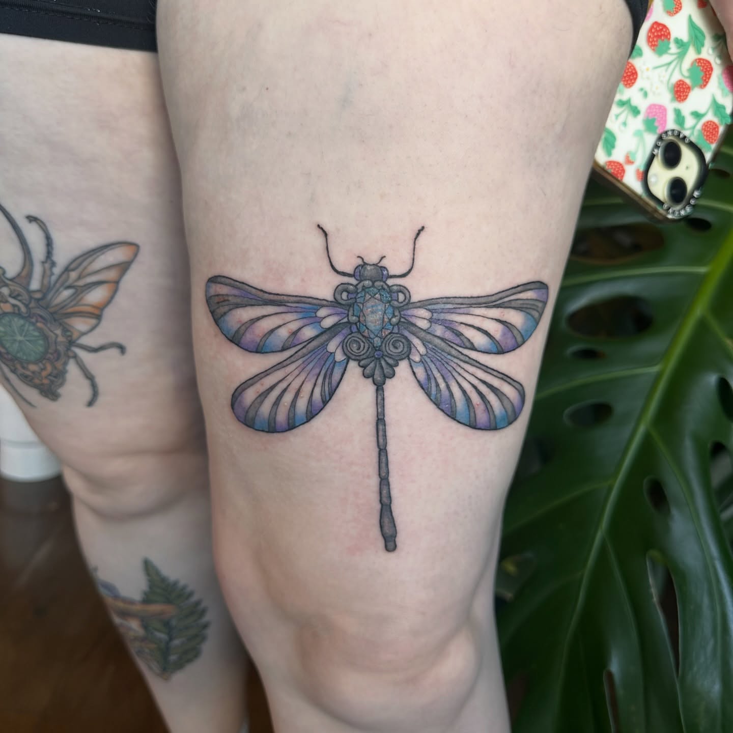 Dragonfly geometric tattoo on the forearm by Ransom
