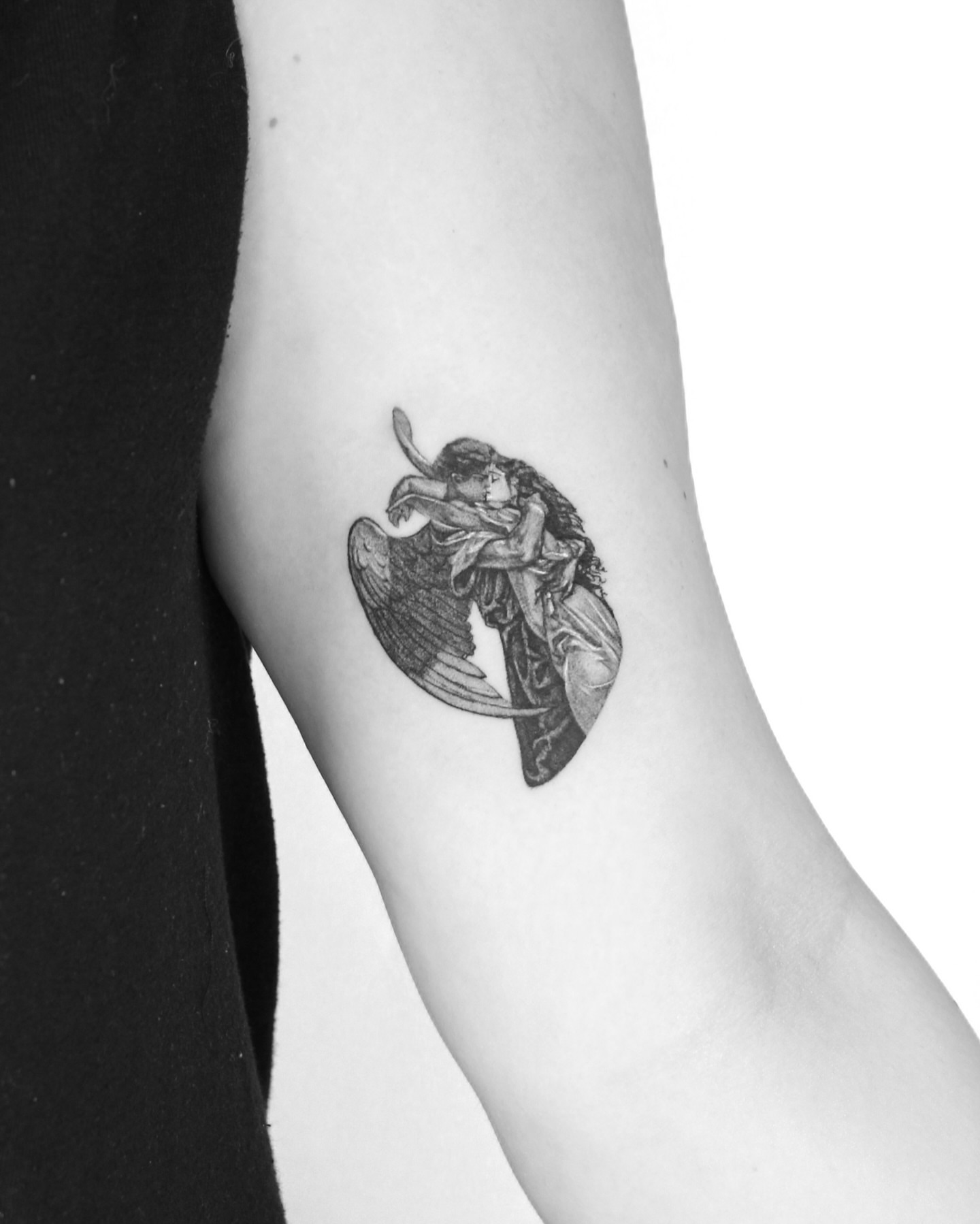 Angel and woman black and grey tattoo on the forearm by Tatmostat