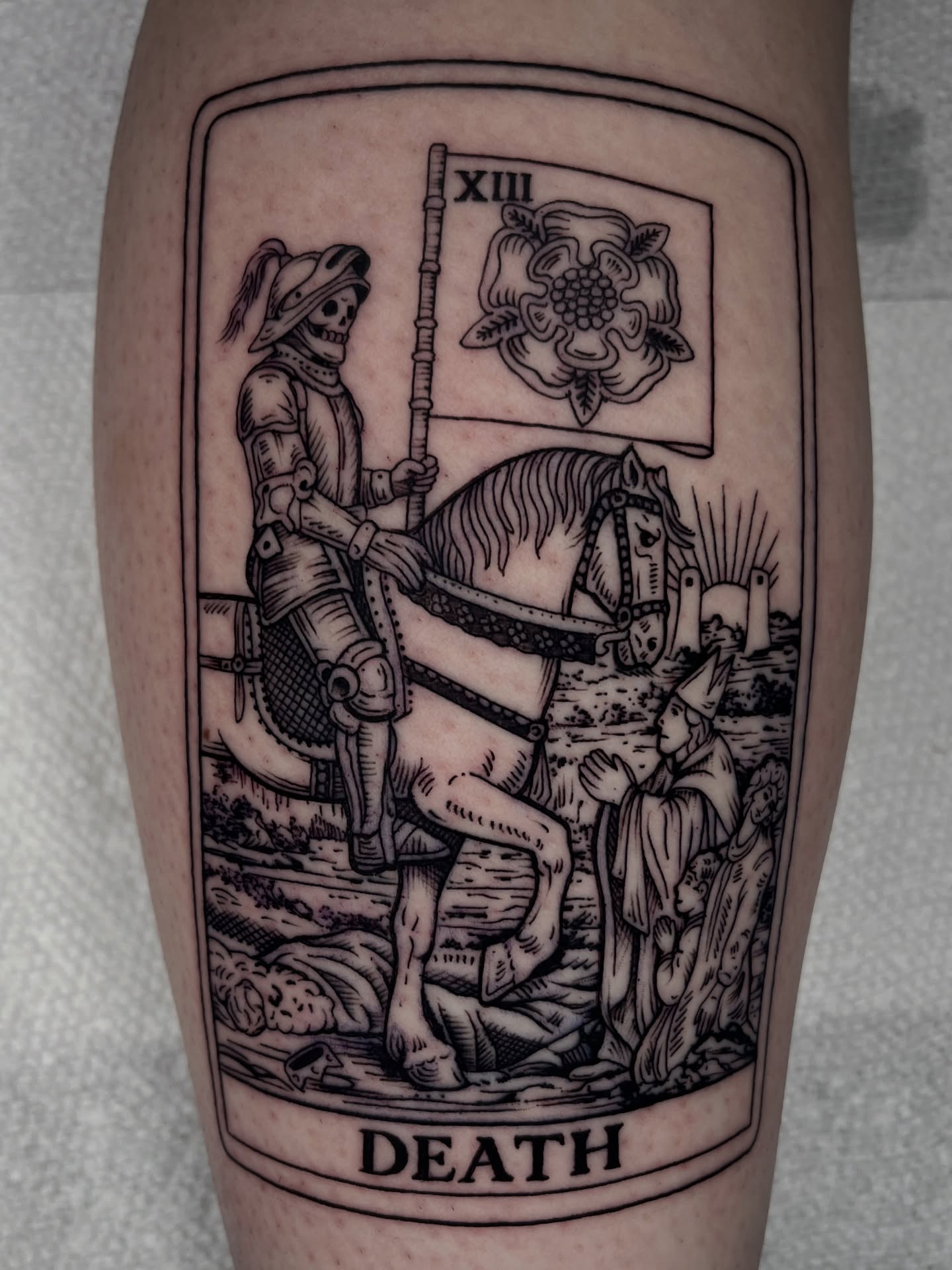 Death card black and grey tattoo on the leg by Jordan Hunt
