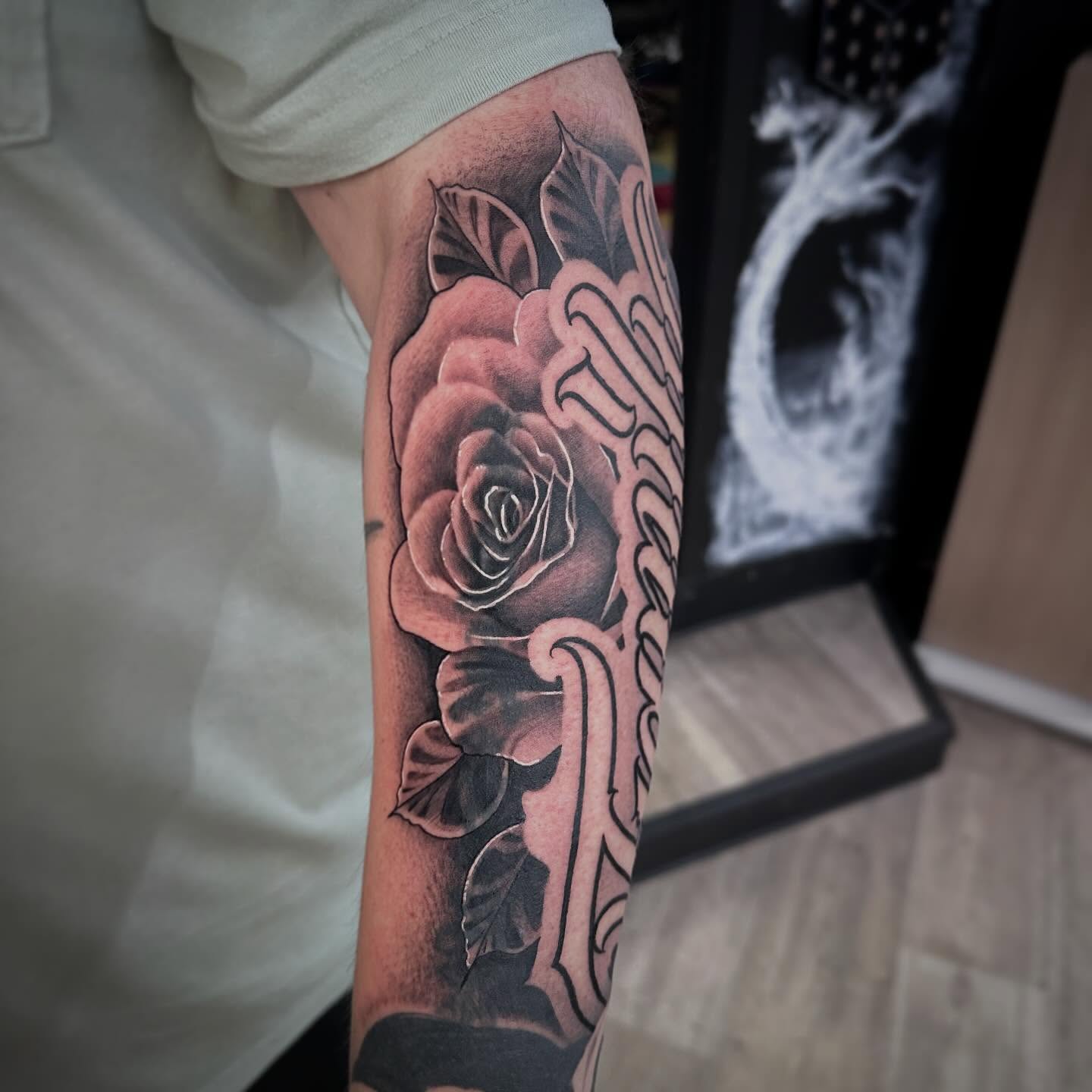 Rose black and grey tattoo on the forearm by Dustin Clark, Dayton, Ohio