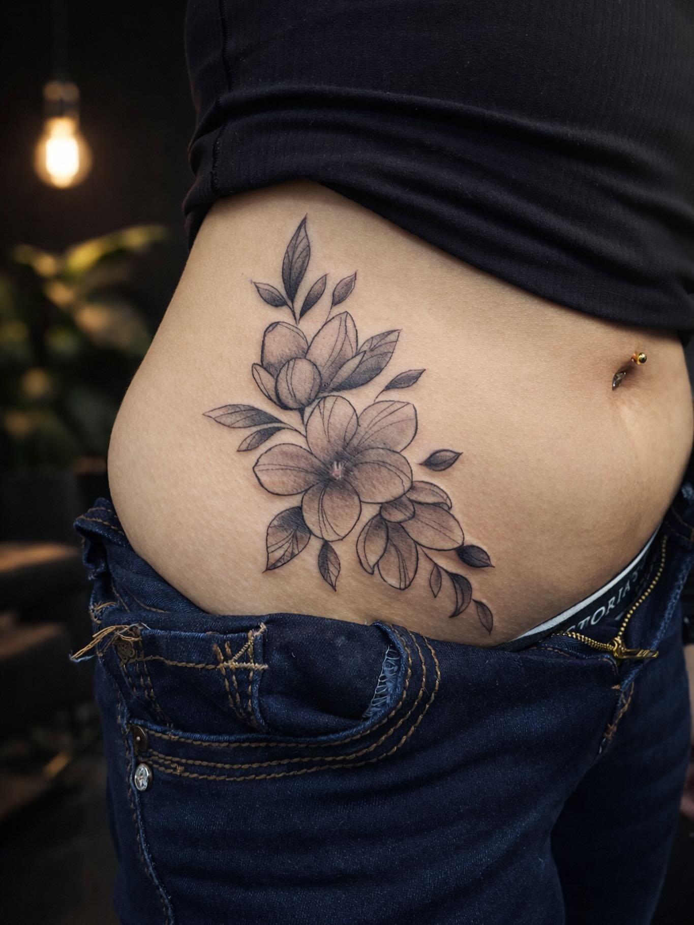 Flower black and grey tattoo on the torso by Angel Jmz
