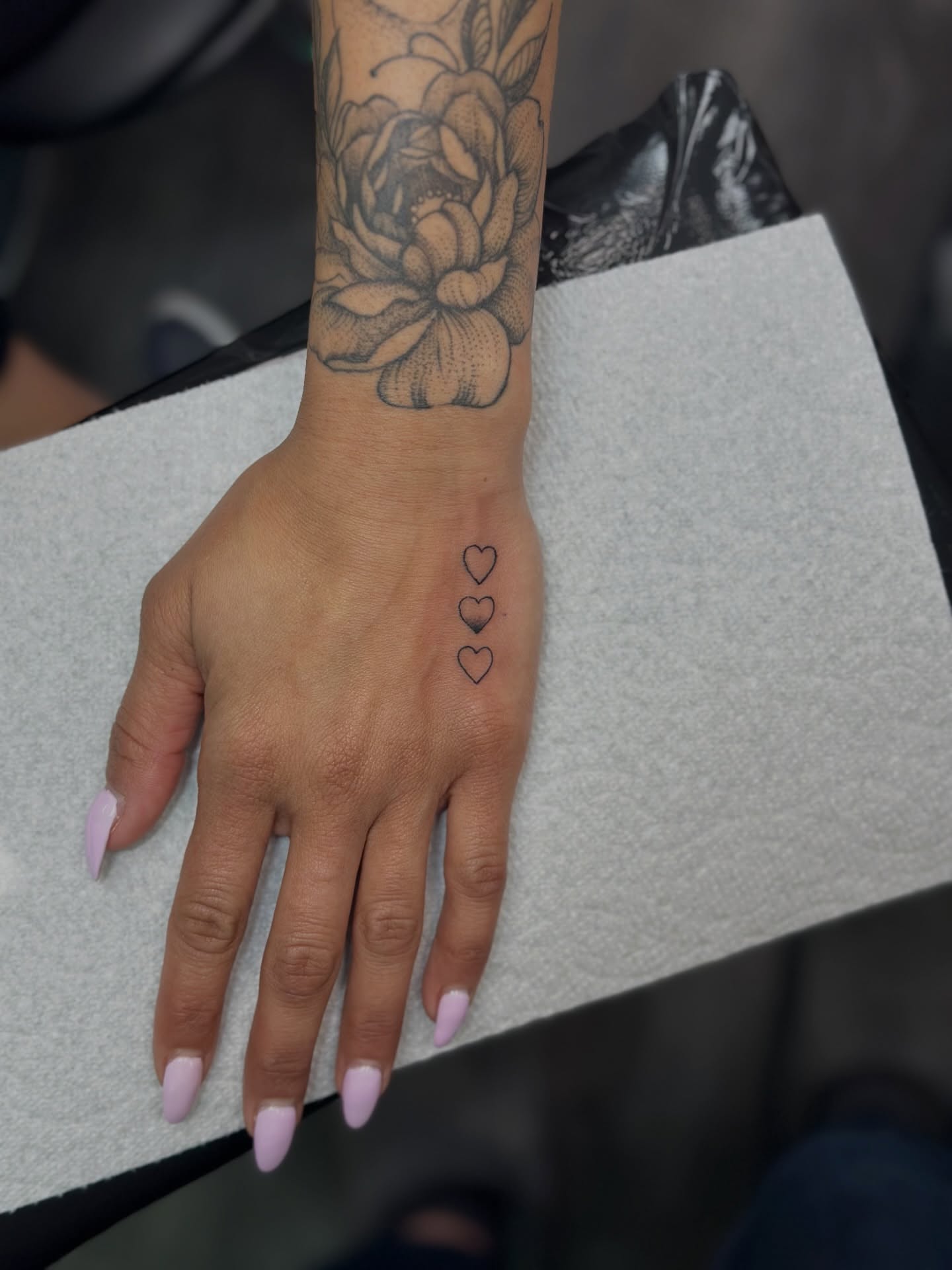 Three hearts black and grey tattoo on the hand by AJ