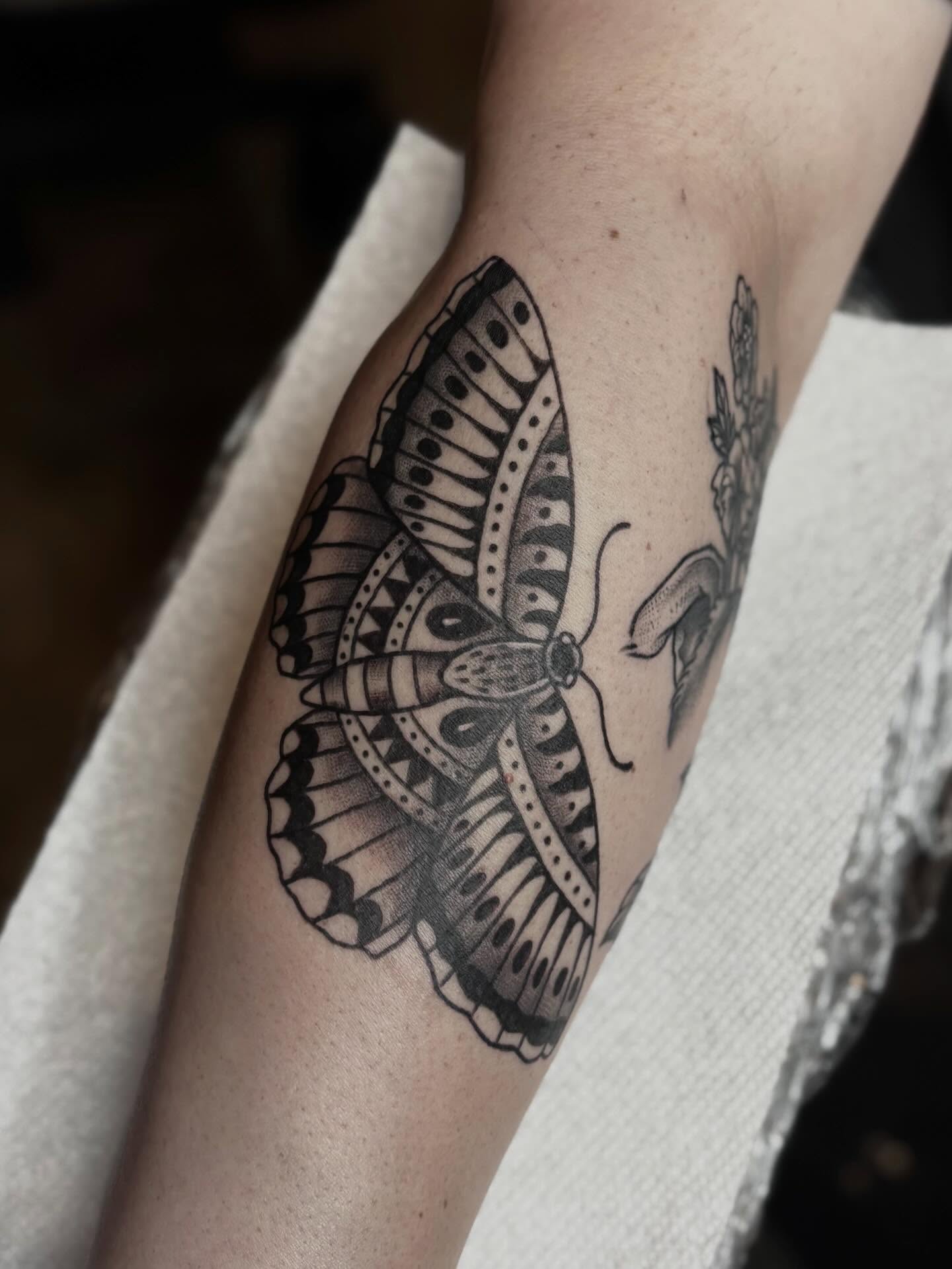 Butterfly black and grey tattoo on the forearm by Mim
