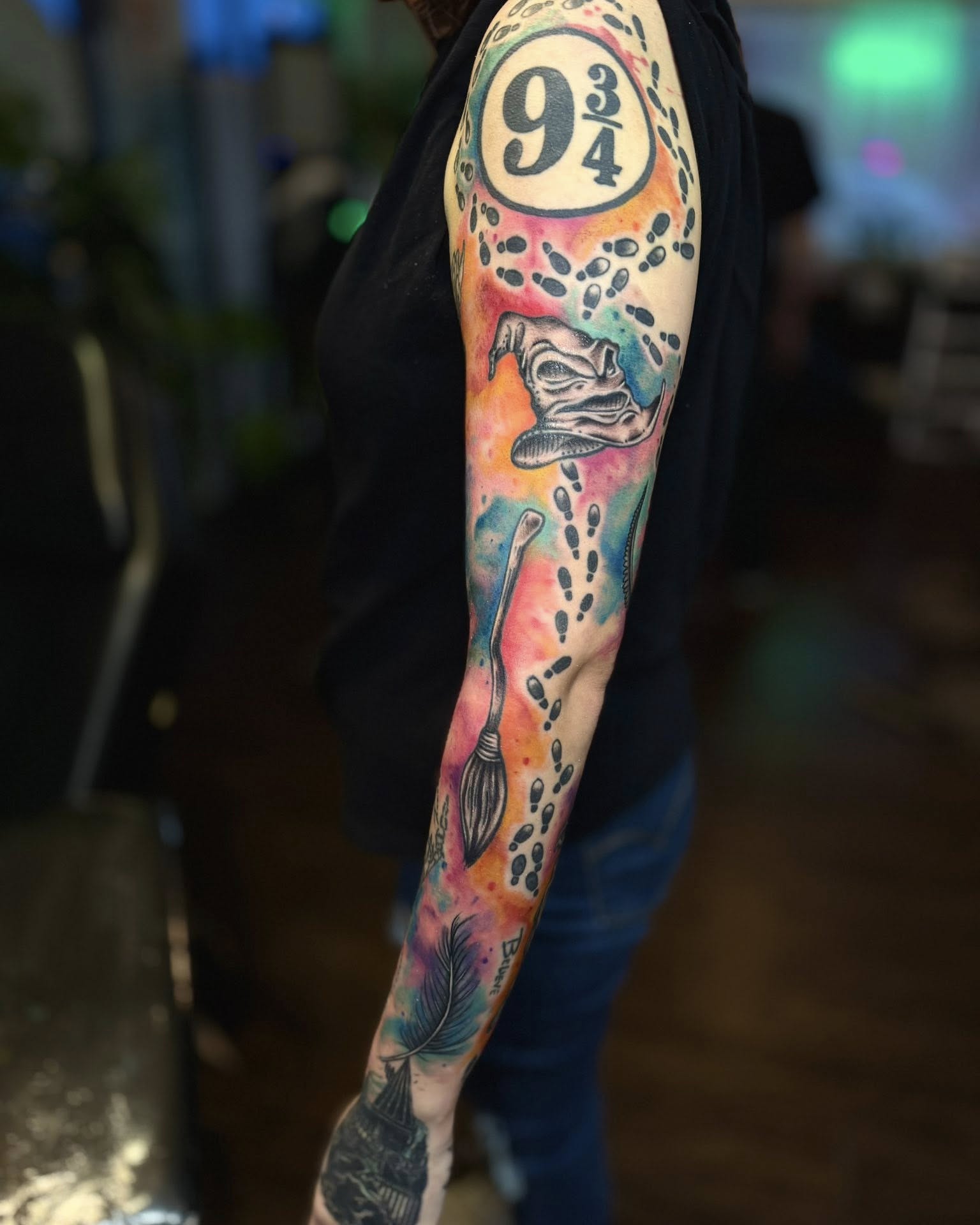 Harry Potter-themed watercolor tattoo on the forearm by Eden Rose, Kalama, Washington