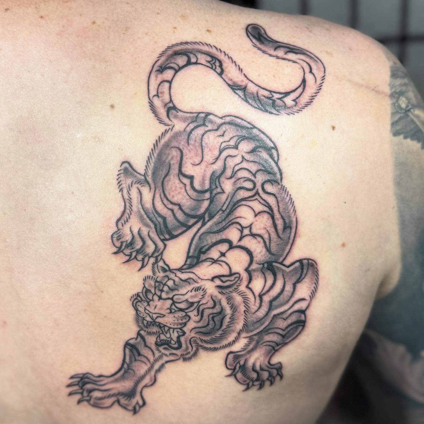 Dragon black and grey tattoo on the shoulder by Justina🪐