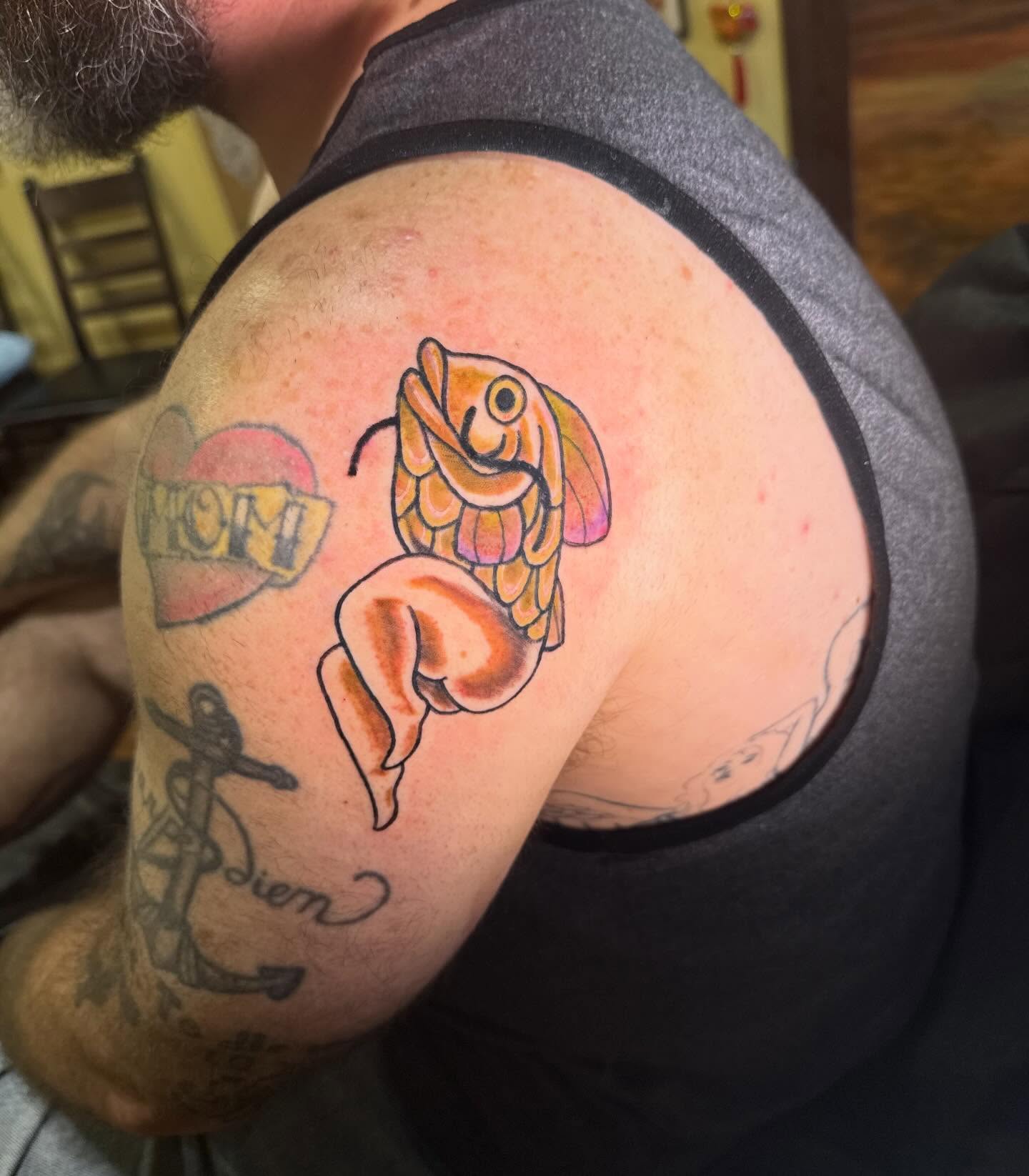 Fish American traditional tattoo on the shoulder by Erin McDavis