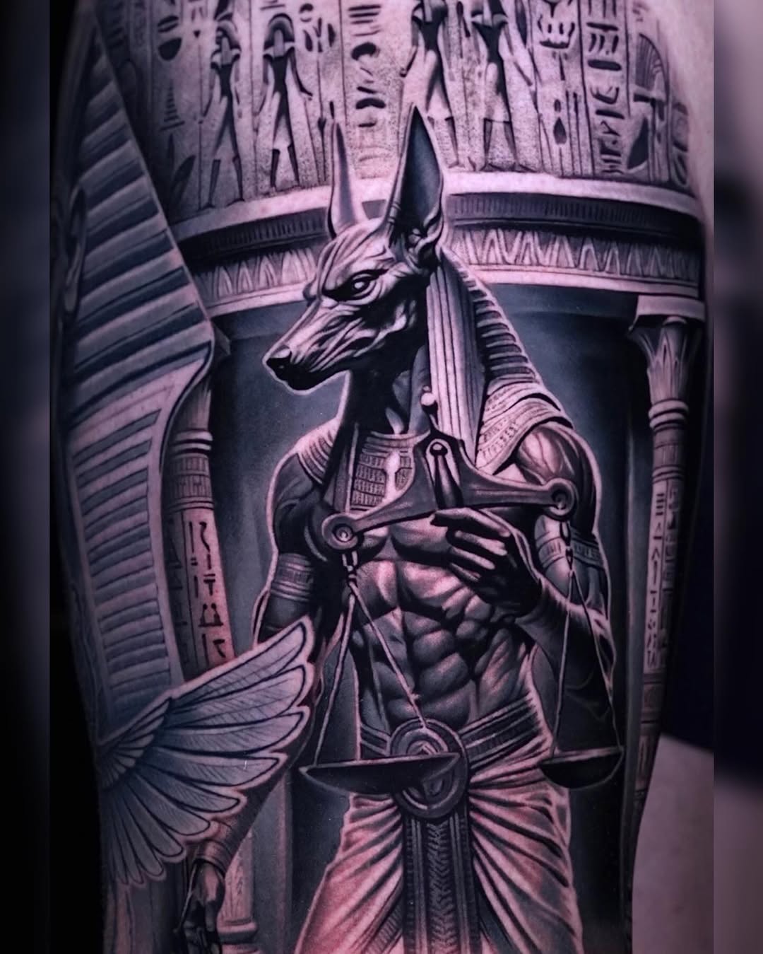 Anubis with scales realism tattoo on the forearm by Sadier Alfonso
