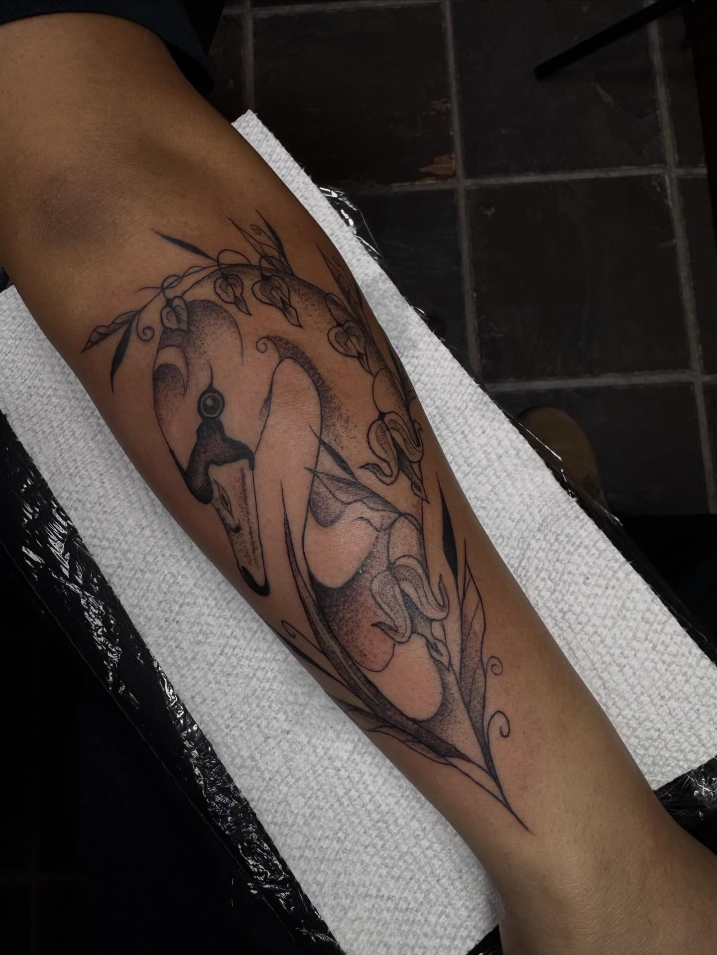 Swan dotwork tattoo on the forearm by olivia reed