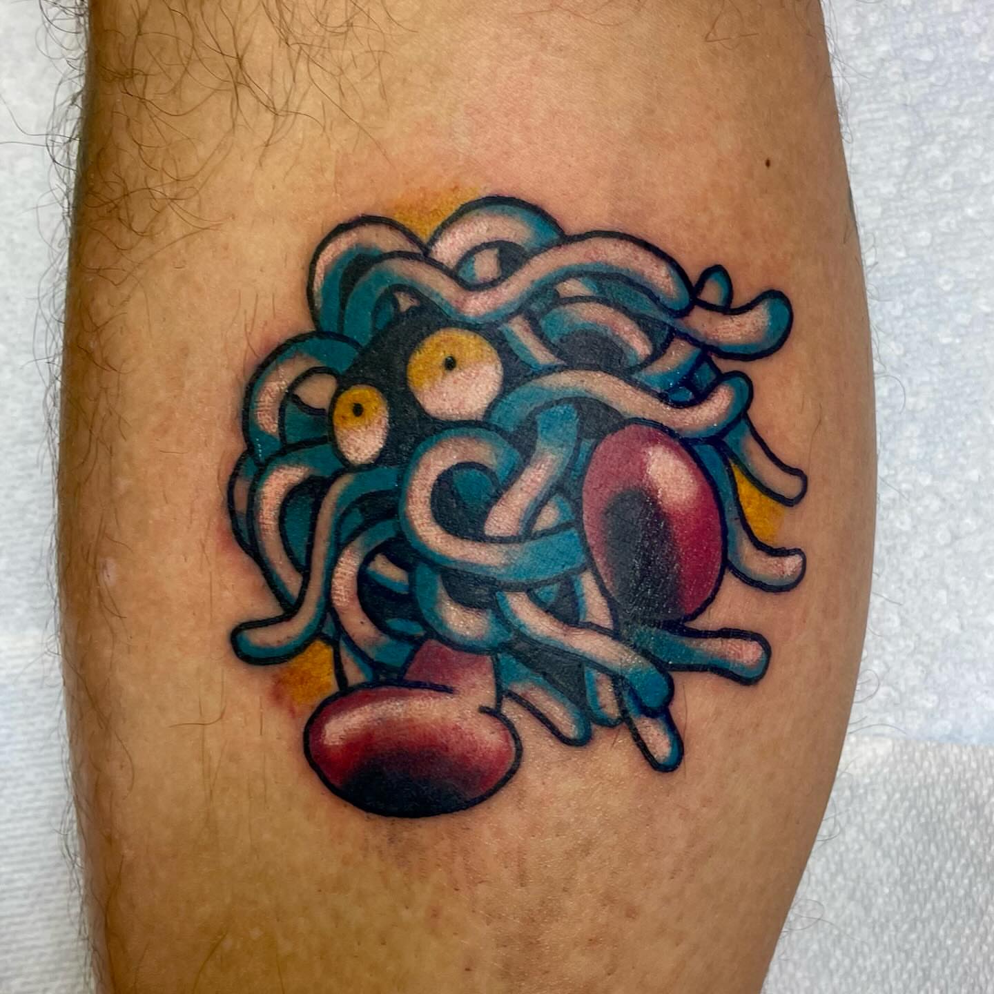Octopus American traditional tattoo on the forearm by Robert Morrow