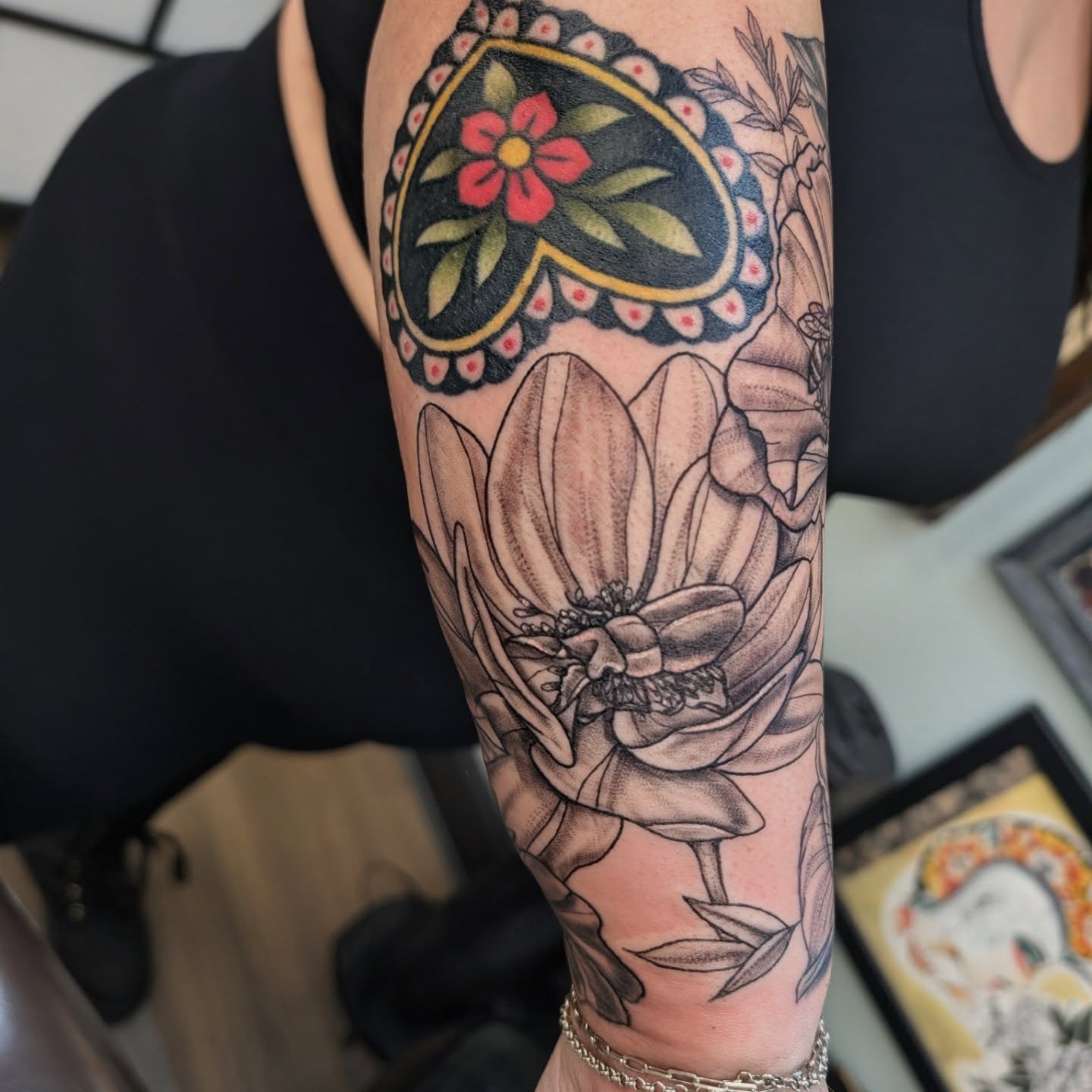 Lotus flower American traditional tattoo on the forearm by Devon Ward, Portland, Oregon