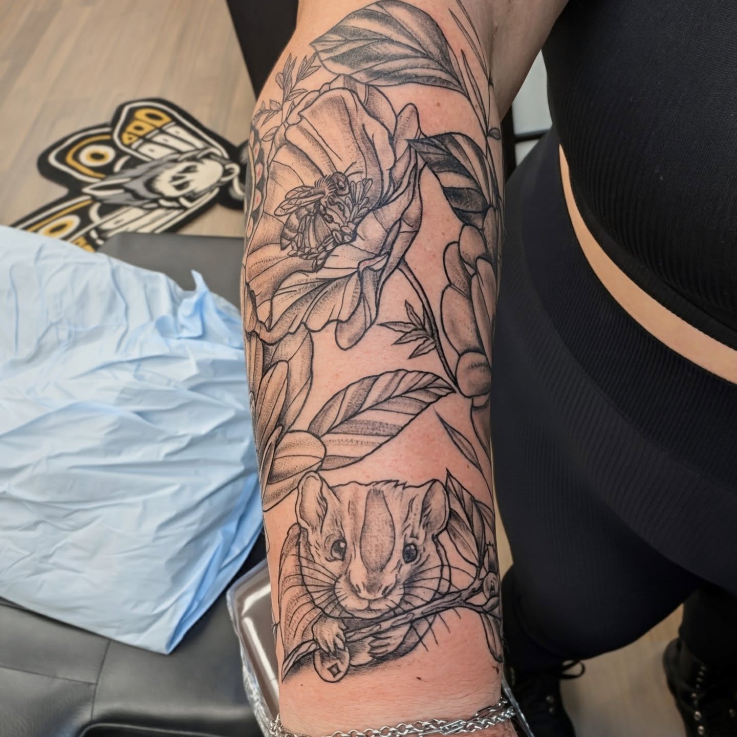 Flower and bee dotwork tattoo on the forearm by Devon Ward, Portland, Oregon