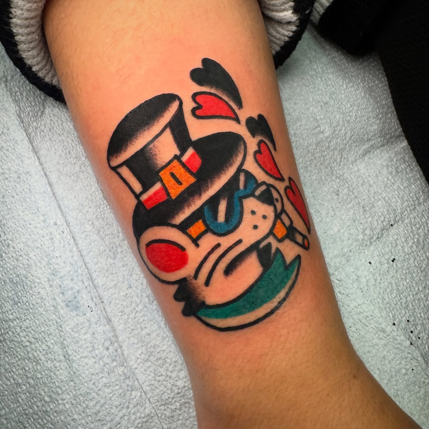 Clown American traditional tattoo on the forearm by Rafael Torres, San Francisco, California
