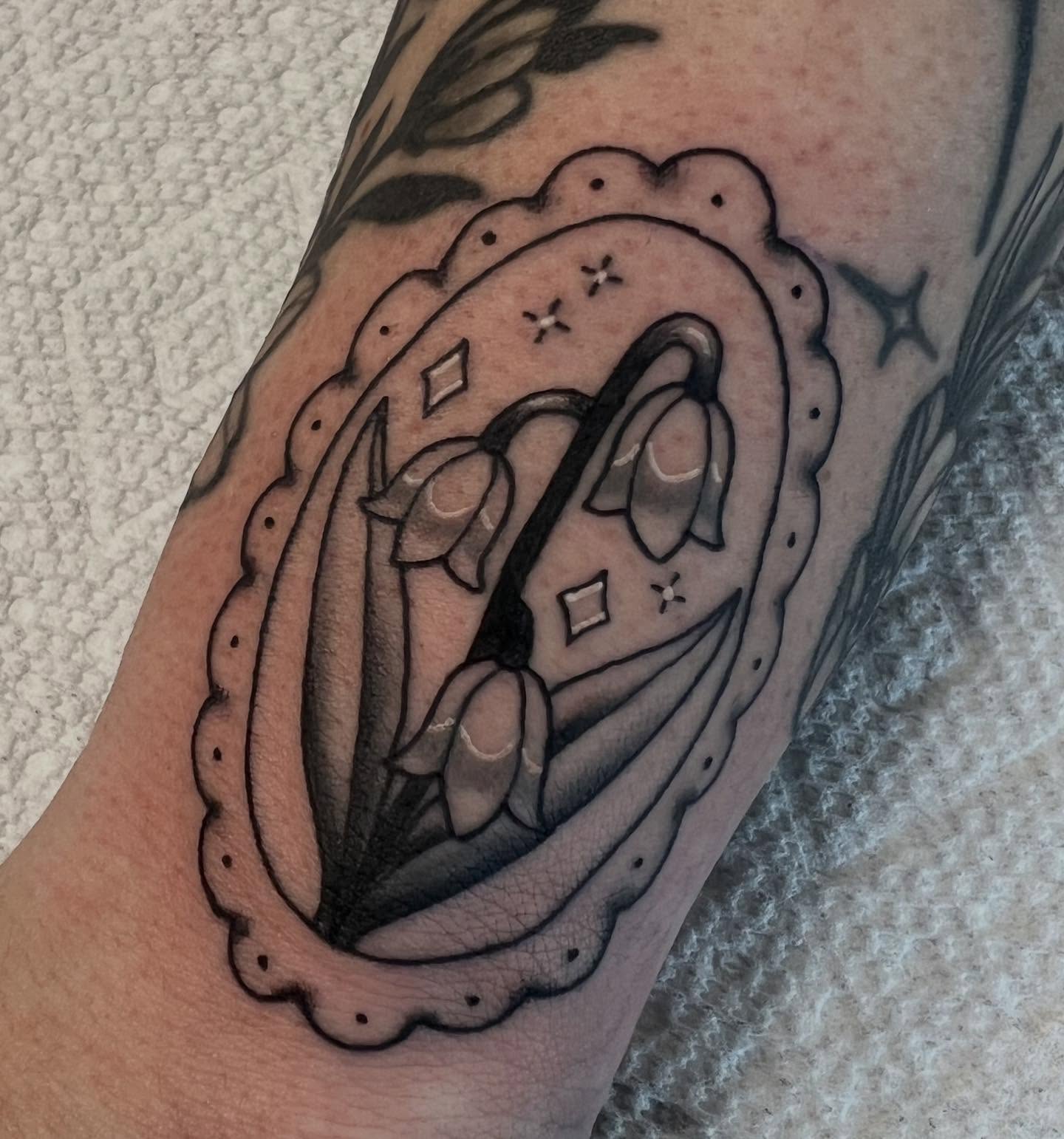 Religious icon black and grey tattoo on the forearm by Kahlan ⍟