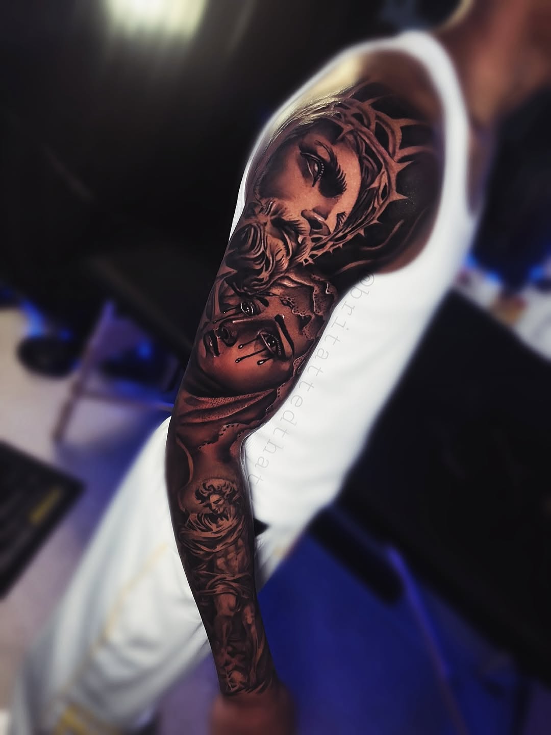 Jesus and crying woman realism tattoo on the forearm by Bri Tatted That