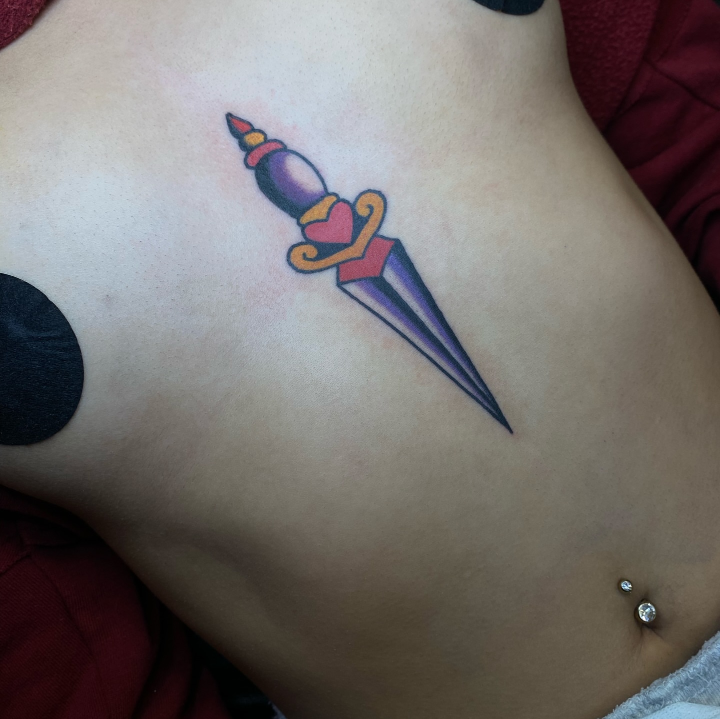 Sword American traditional tattoo on the ribs by ⛓️ L̷i̷n̷n̷e̷a̷⛓️, Las Vegas, Nevada
