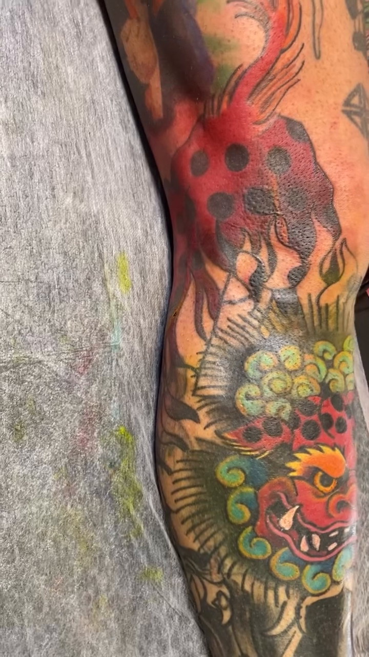 Dragon and floral leg sleeve Japanese tattoo on the upper arm by jim collins, Dayton, Ohio