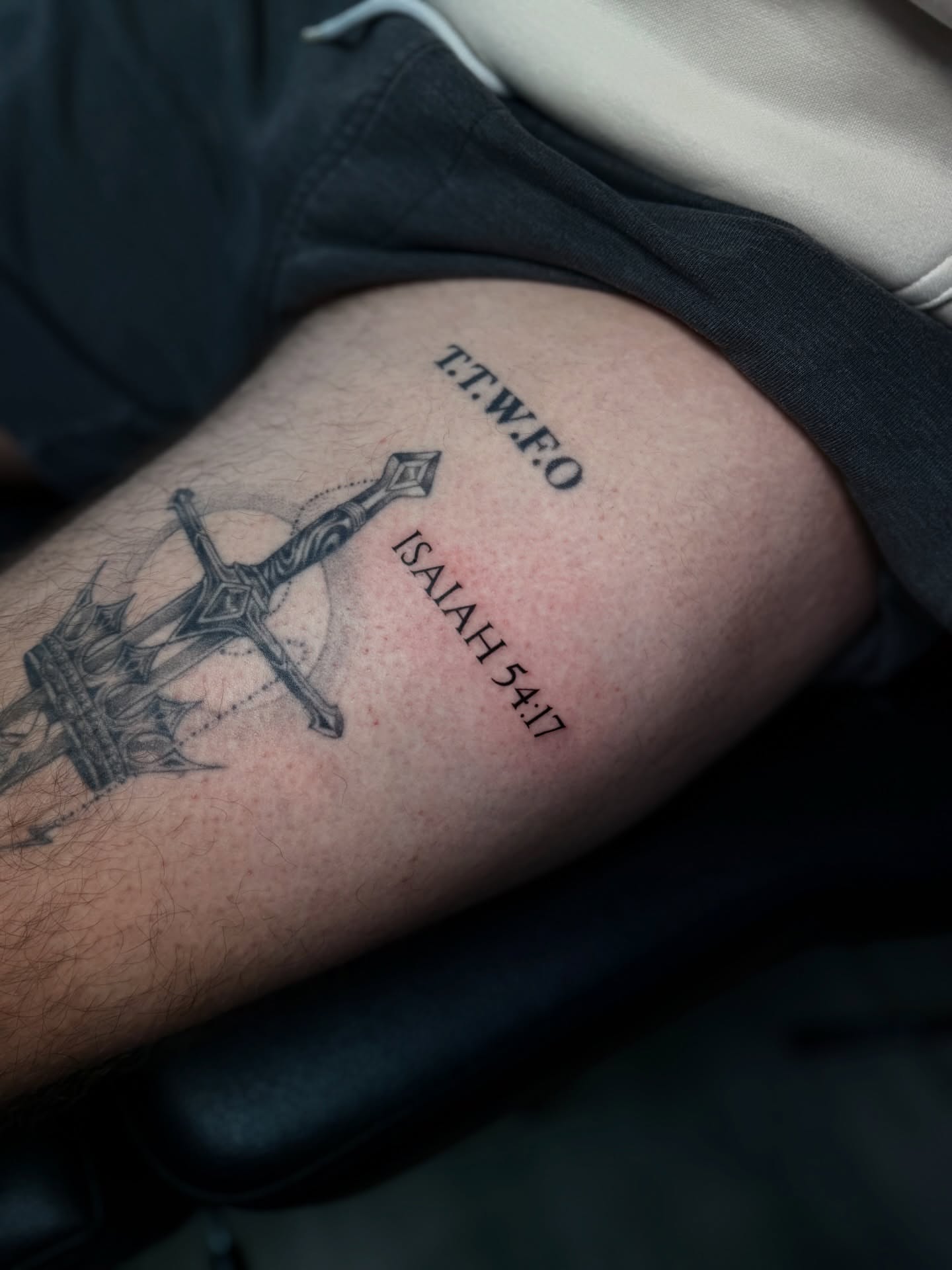 Sword and tower black and grey tattoo on the forearm by Elijah Cosme, Miami, Florida