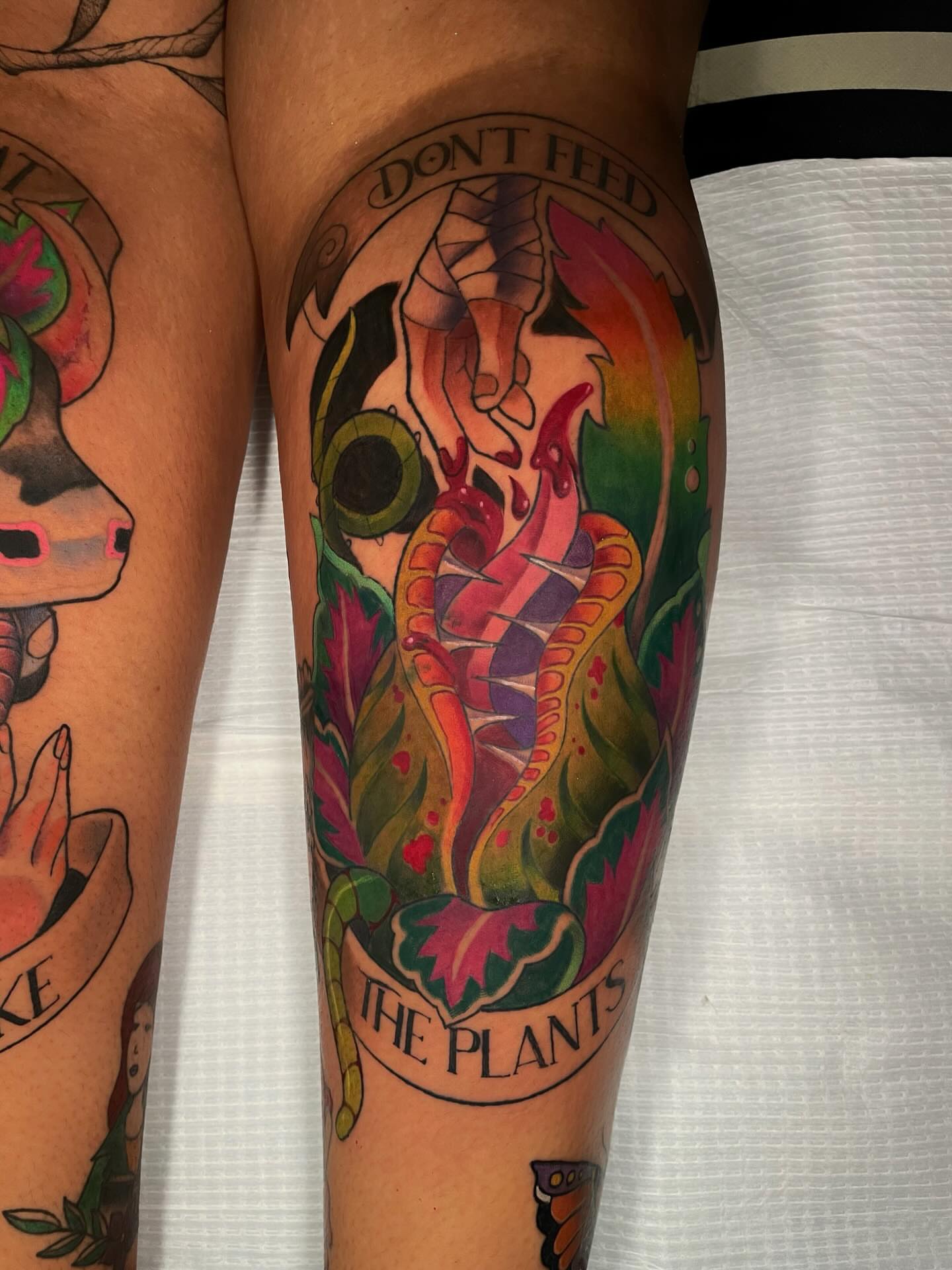 Plant creature American traditional tattoo on the calf by Xena