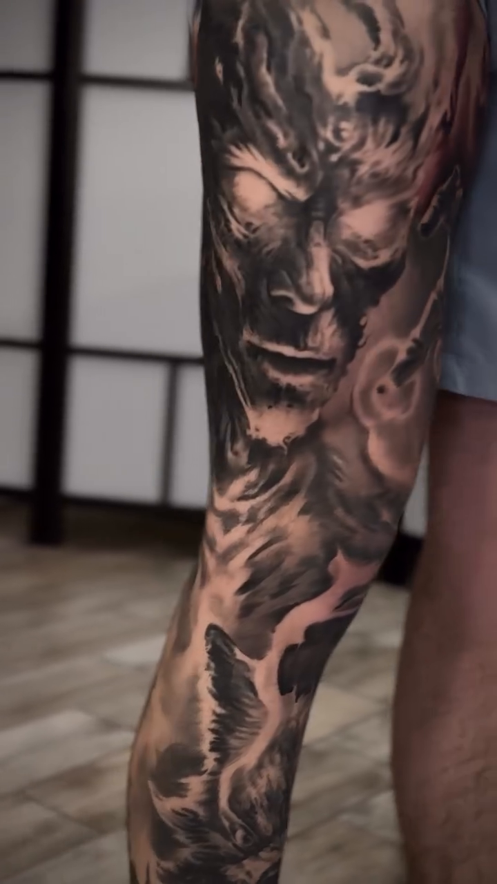 Demonic figure with cityscape dark realism tattoo by Tony Ink