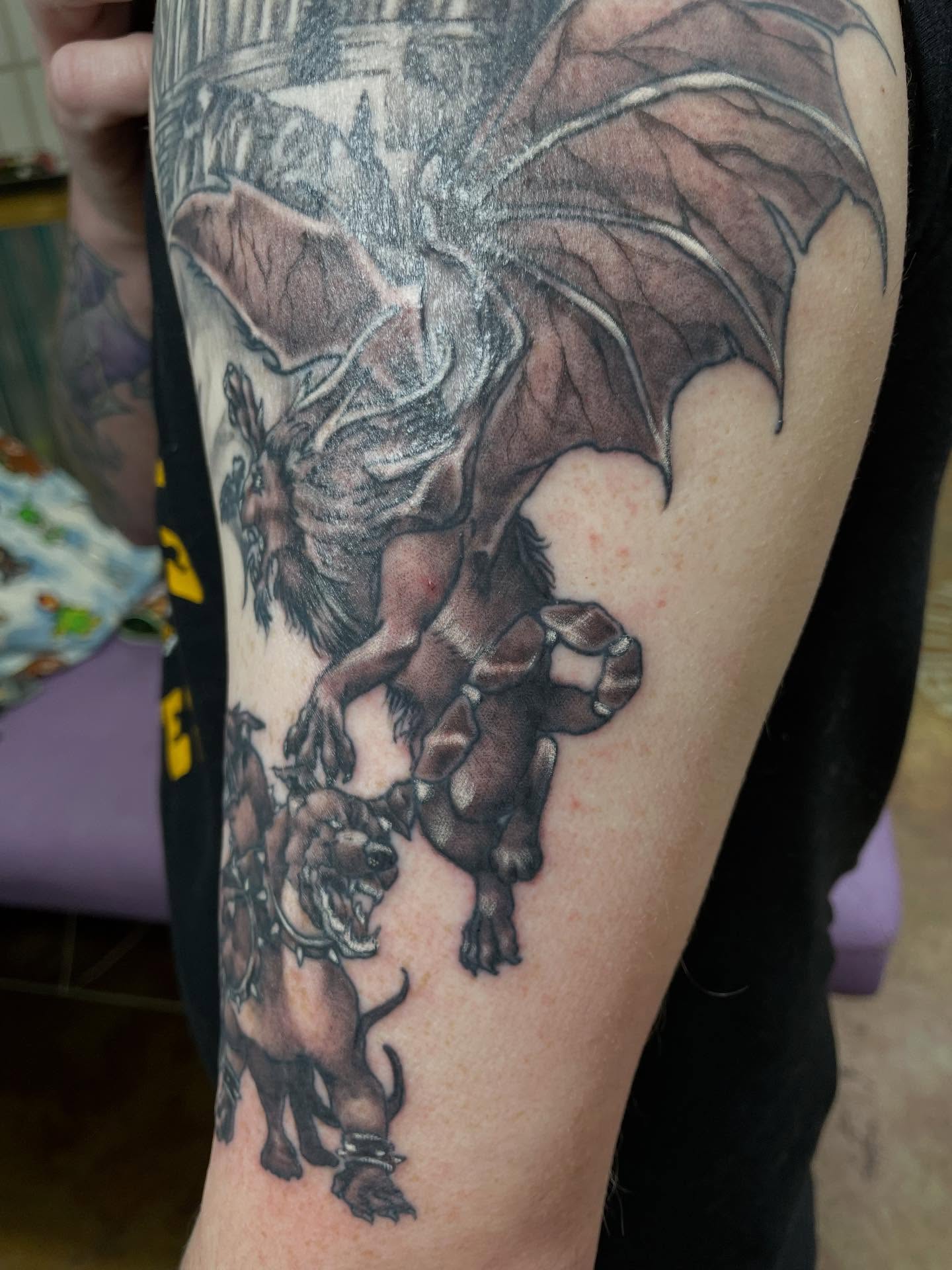 Dragon and lion realism tattoo on the forearm by Heather Freitag