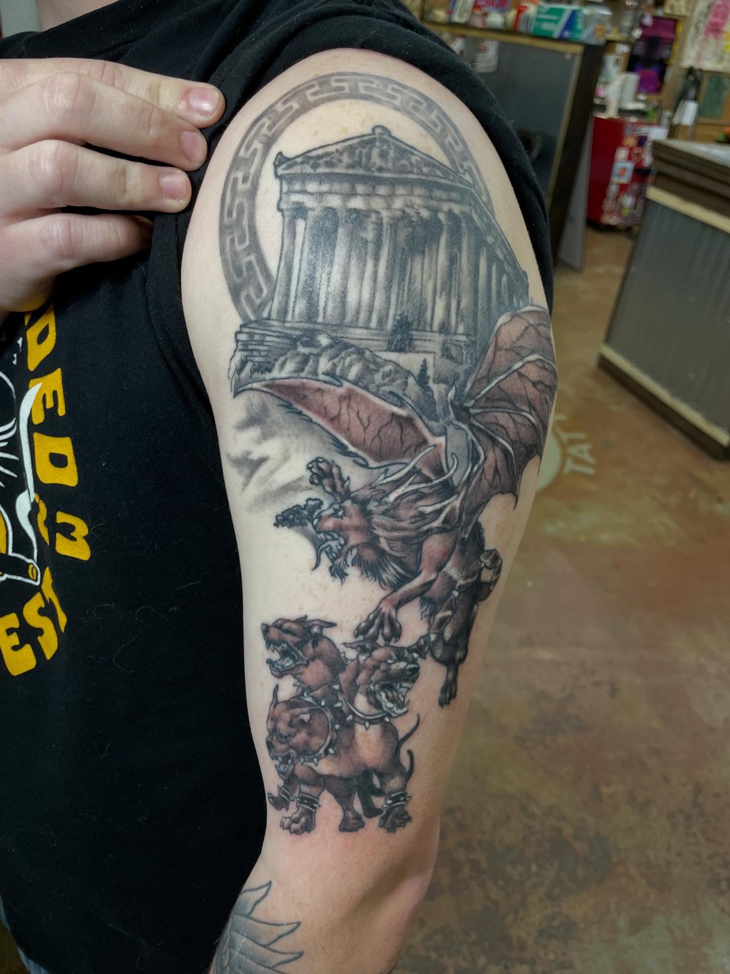 Mythical creature and temple realism tattoo on the shoulder by Heather Freitag