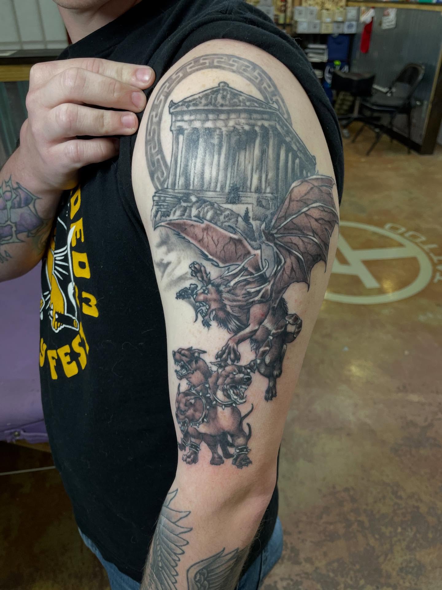 Mythical creature and temple realism tattoo on the shoulder by Heather Freitag