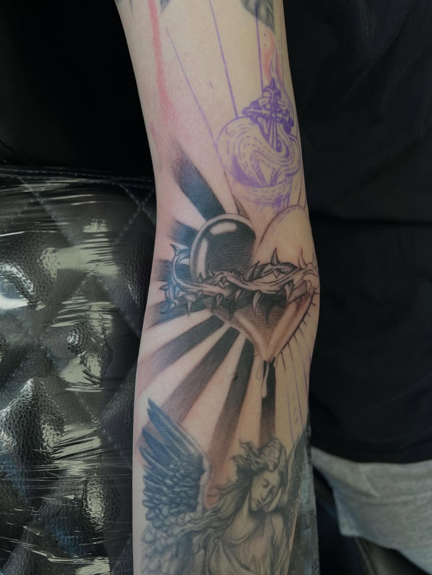 Angel with sword realism tattoo on the forearm by San Diego Fineline Black & Grey Tattoo Artist